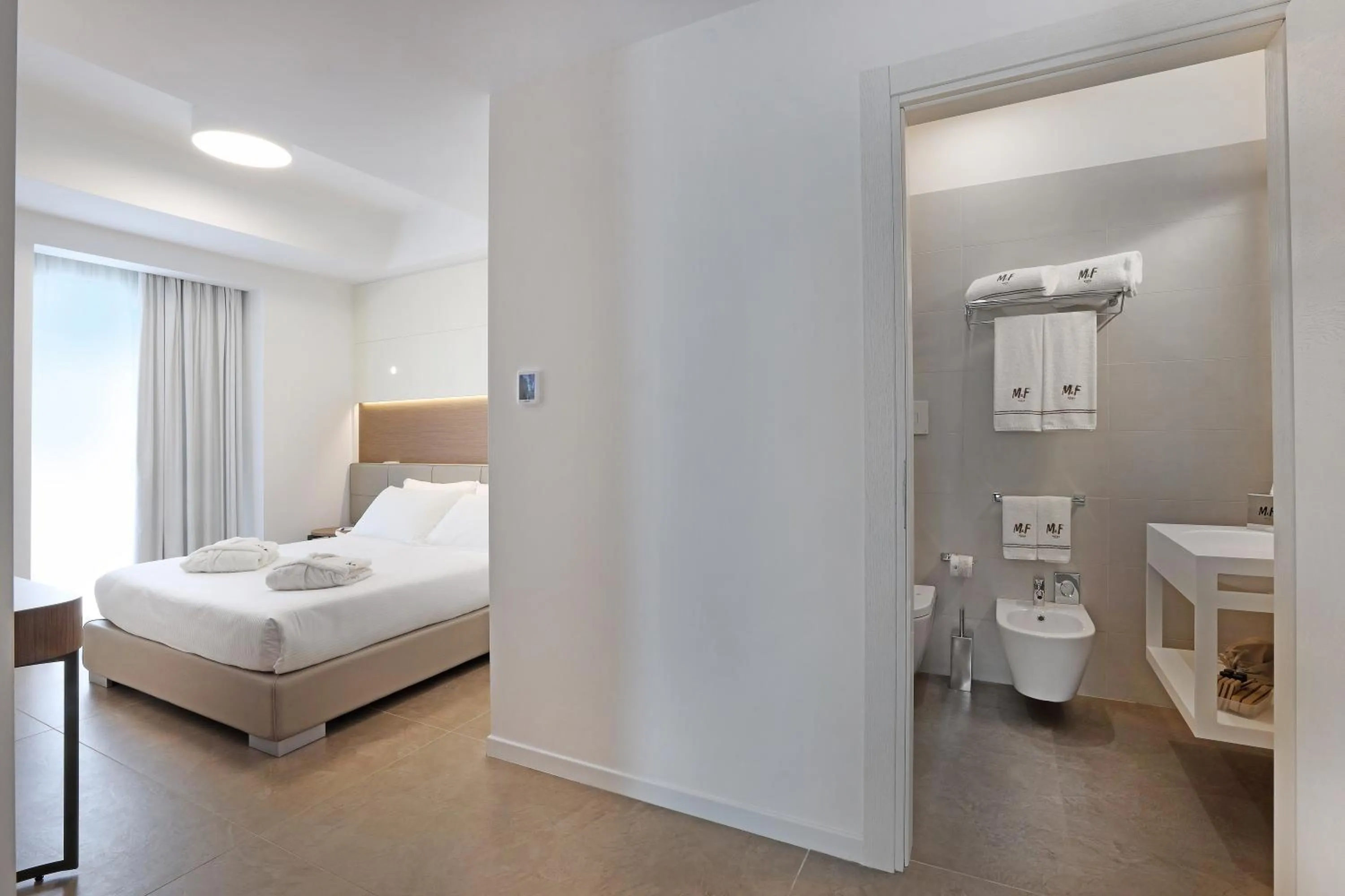 Photo of the whole room, Bed in M&F Hotel