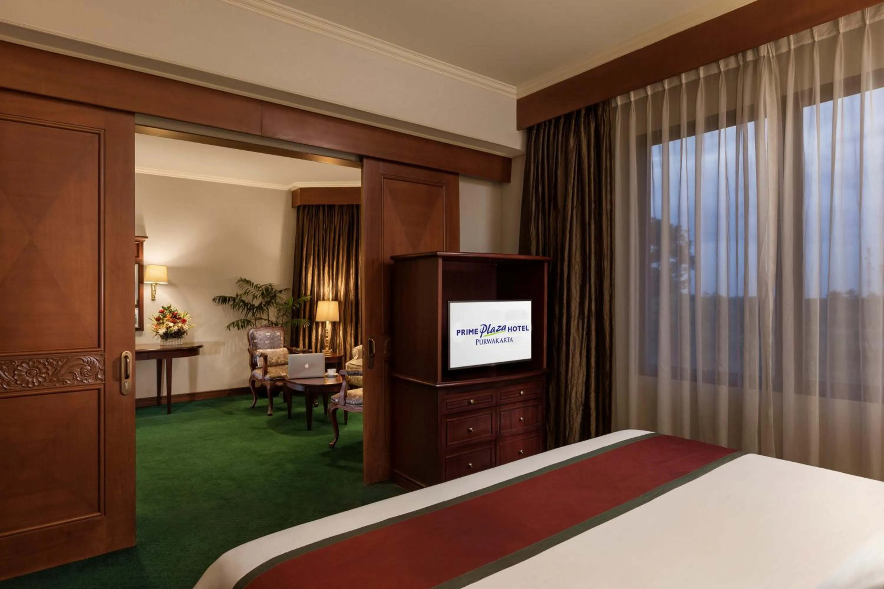 Communal lounge/ TV room, Bed in Prime Plaza Hotel Purwakarta