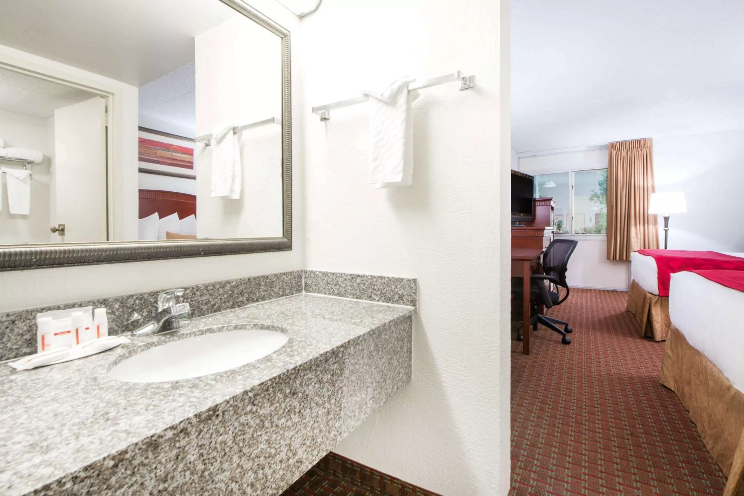 Bathroom, Bed in Ramada by Wyndham Enid