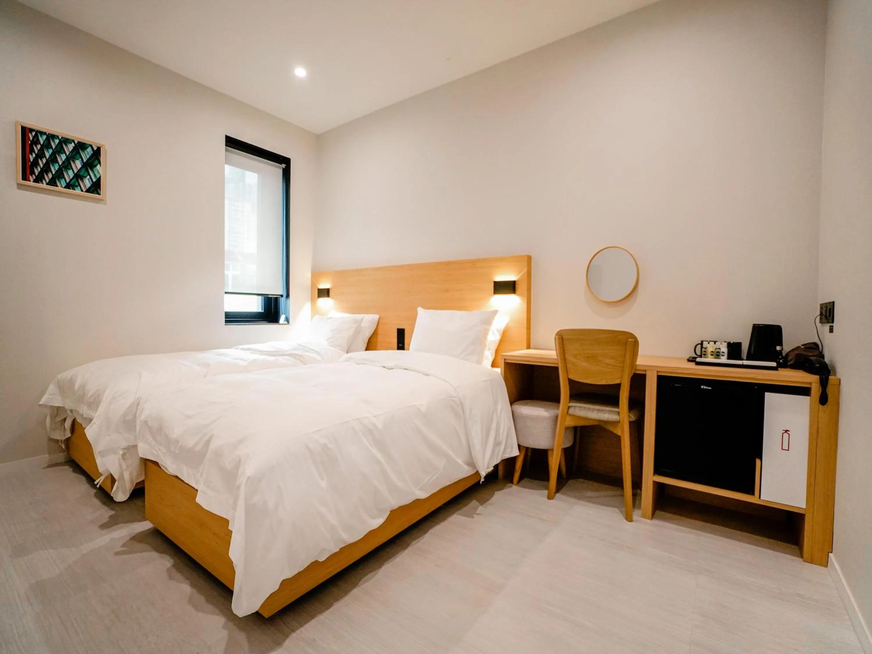 Bed in Mipo Oceanside Hotel