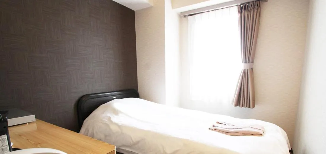 Bed in Takamatsu City Hotel