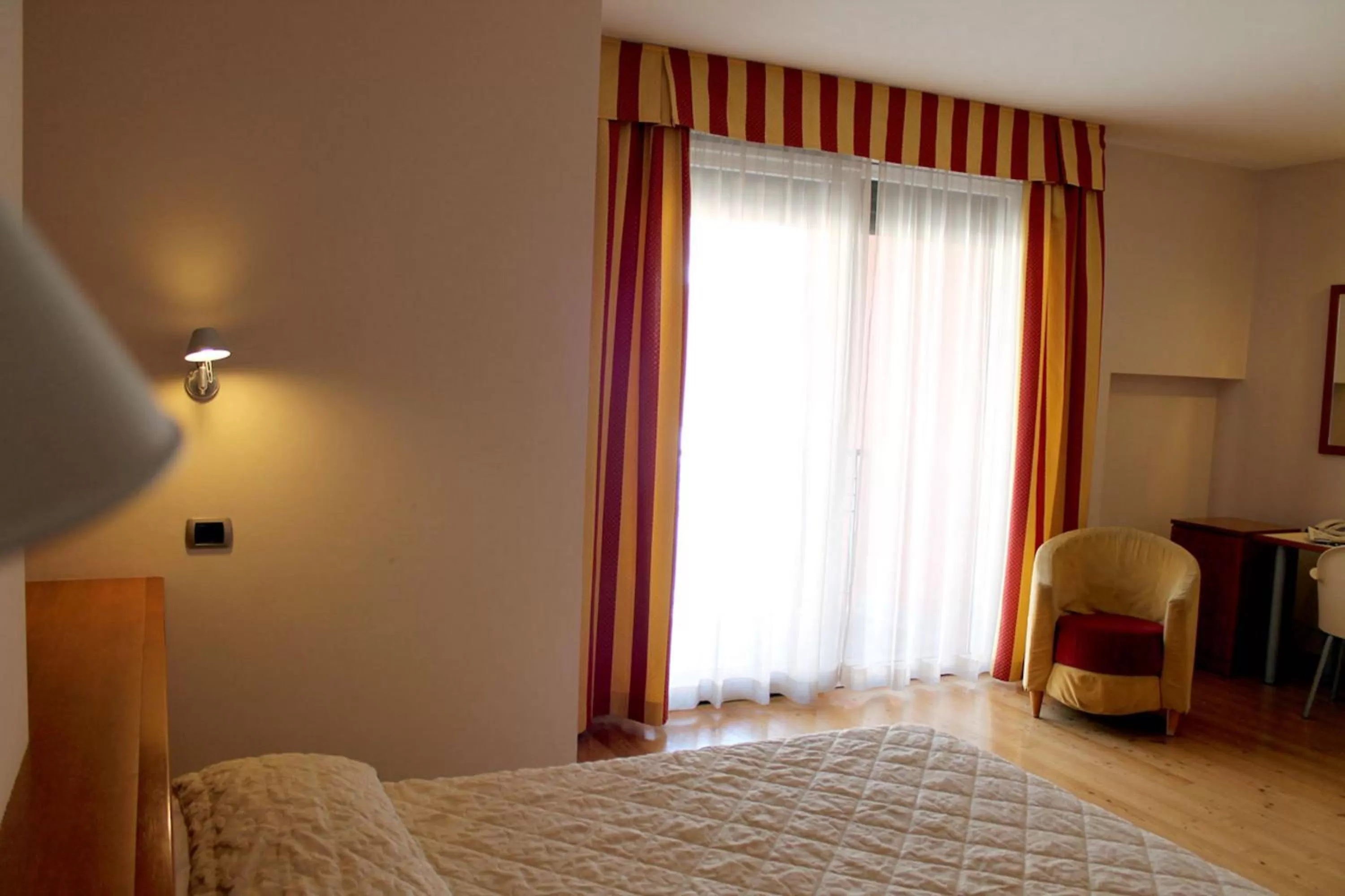 Bed in Hotel Rubicone