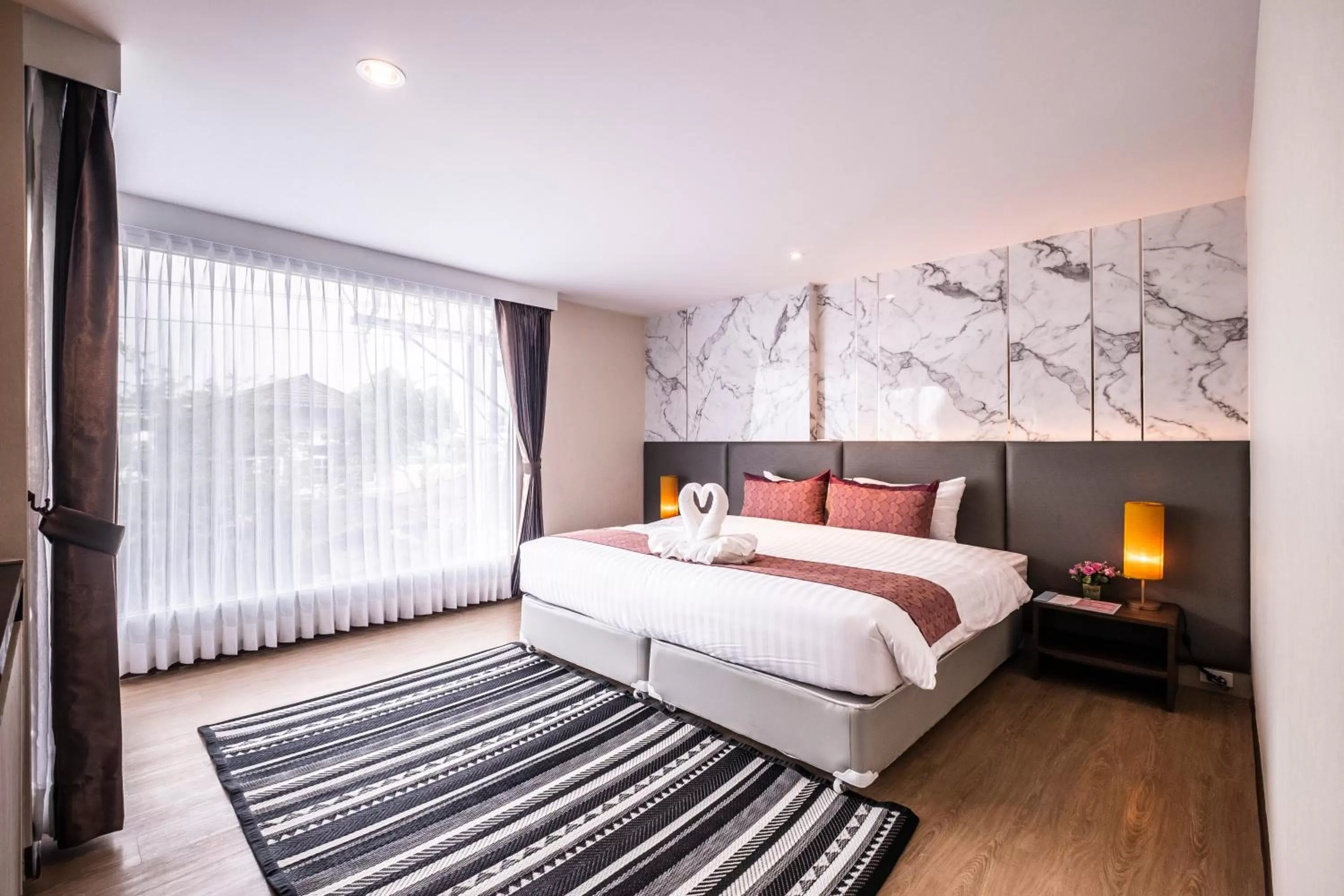 Bed in Sinsuvarn Airport Suite Hotel