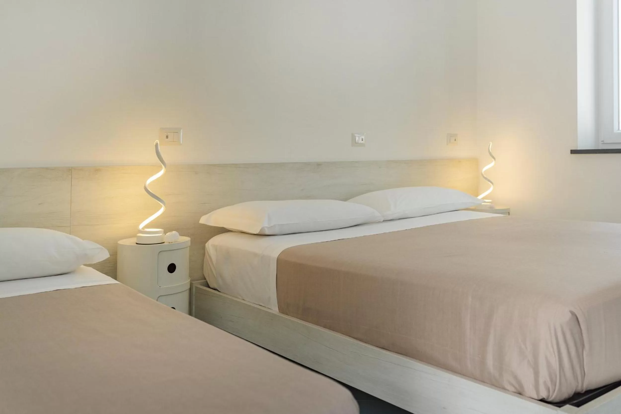 Bed in Poseidonia Rooms