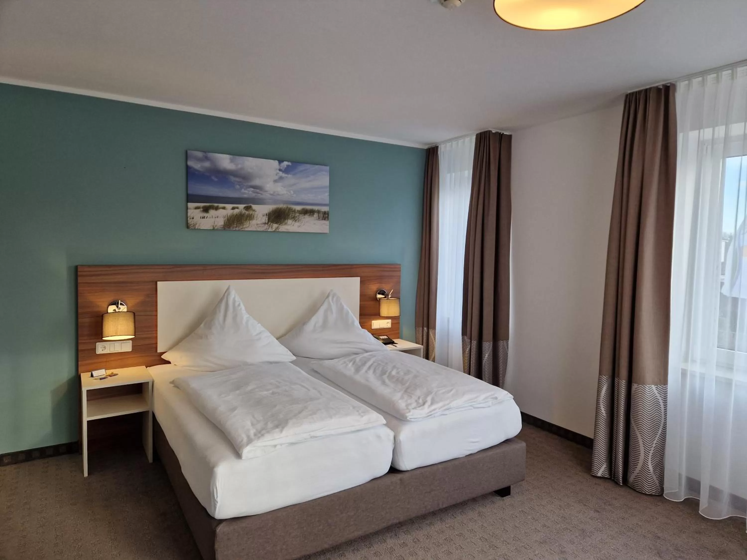 Photo of the whole room, Bed in Hotel Friesische Wehde