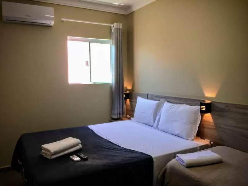 Bed in Pousada Tissiano