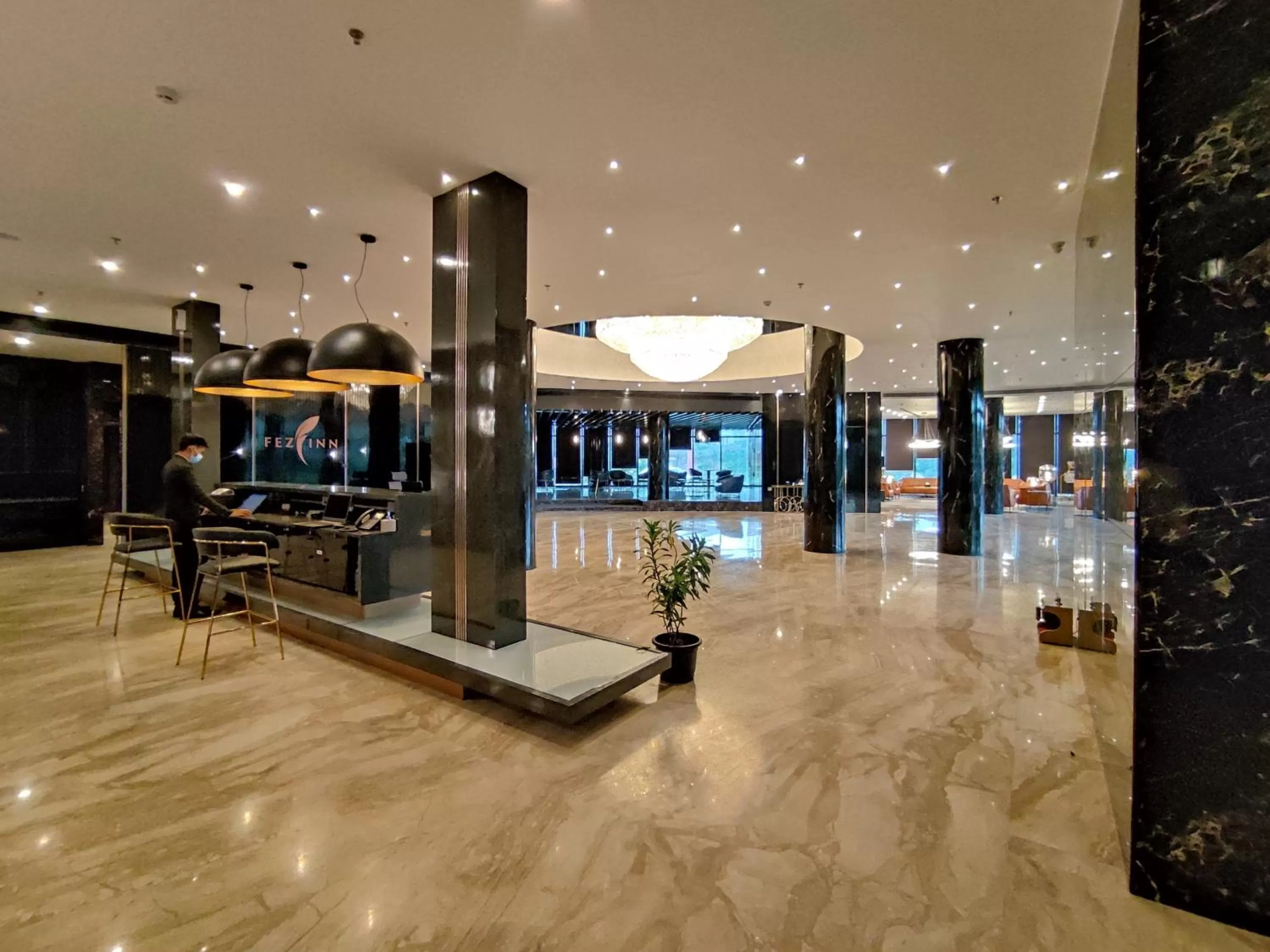 Property logo or sign in Fezinn Hotel - Best Wayanad Hotel in 2024