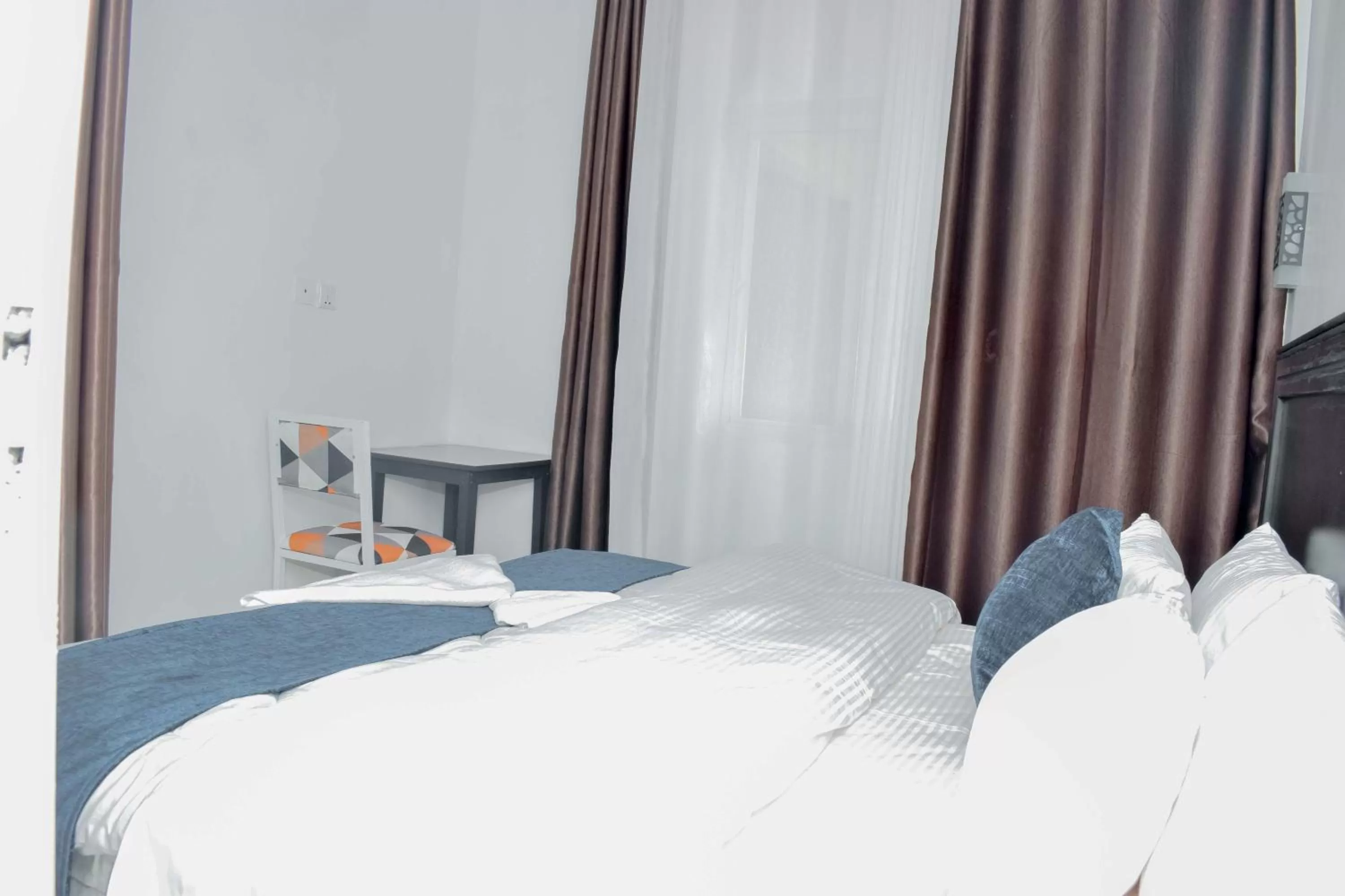 Bed in INZOZI AFRICA HOUSE B&B-Gishushu