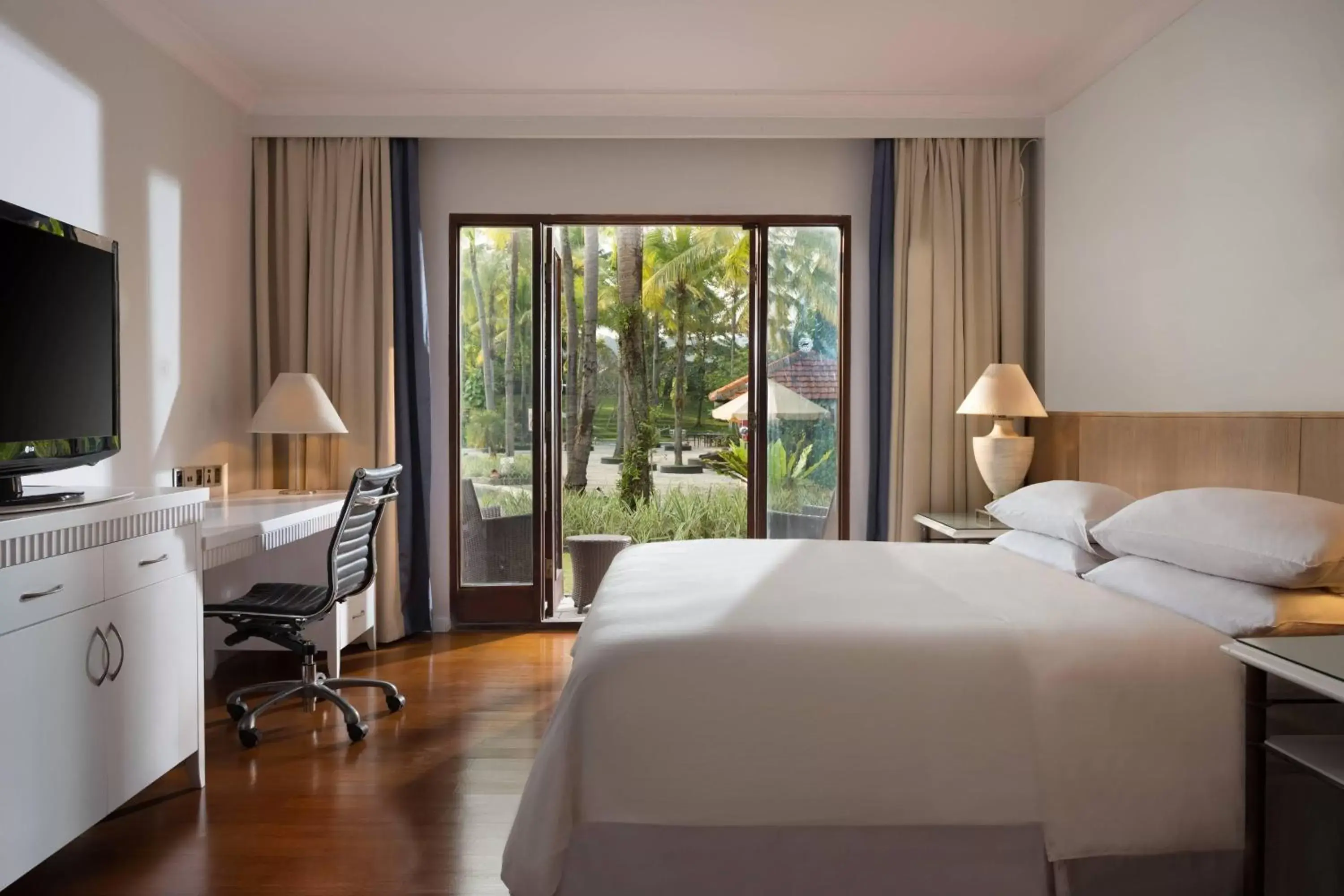 Deluxe King Room with Terrace and Garden Access - Non-Smoking in AKAR Hotels & Resort Lampung Deluxe King Room with Terrace and Garden Access - Non-Smoking in AKAR Hotels & Resort Lampung