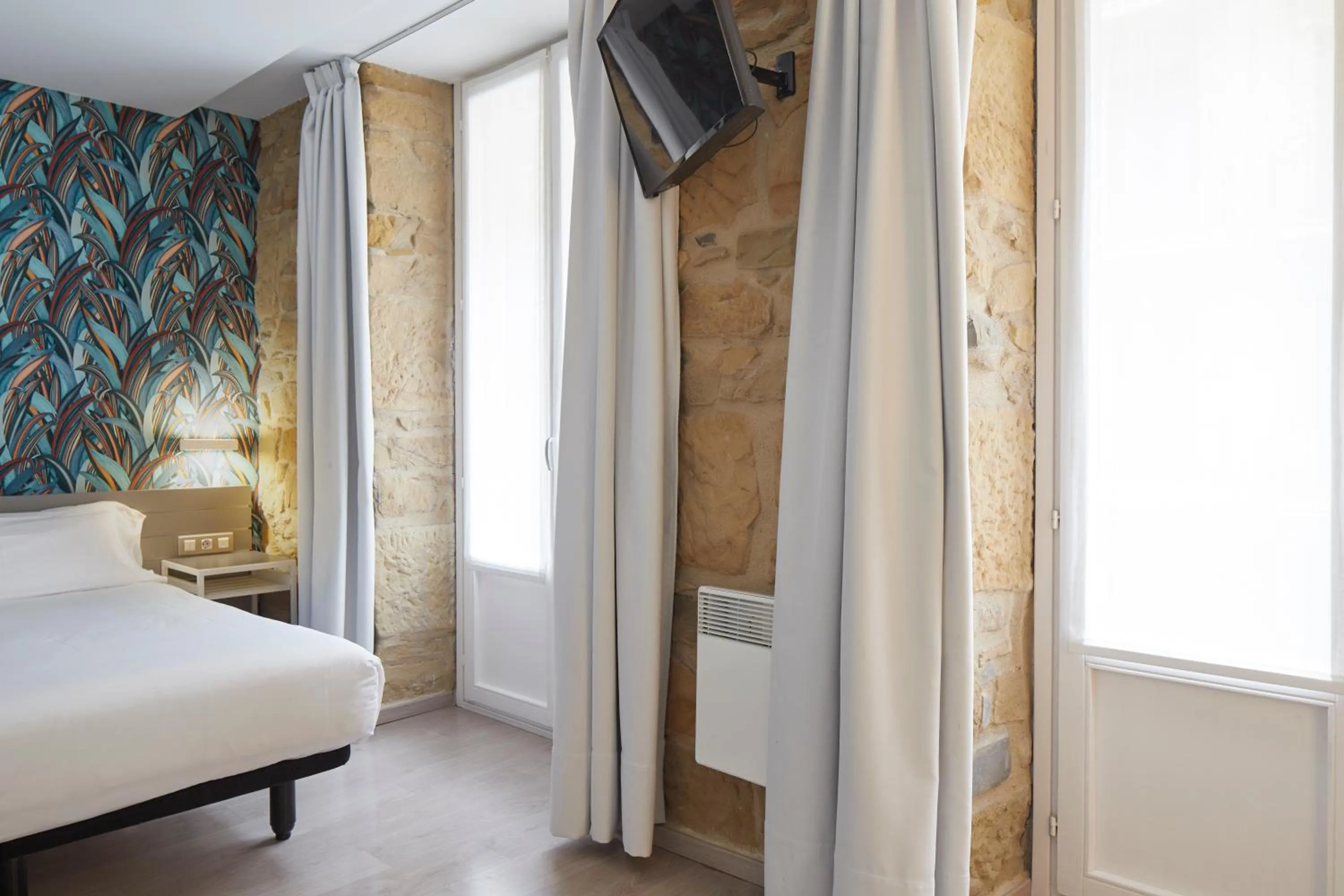 Bed in Welcome Gros Hotel