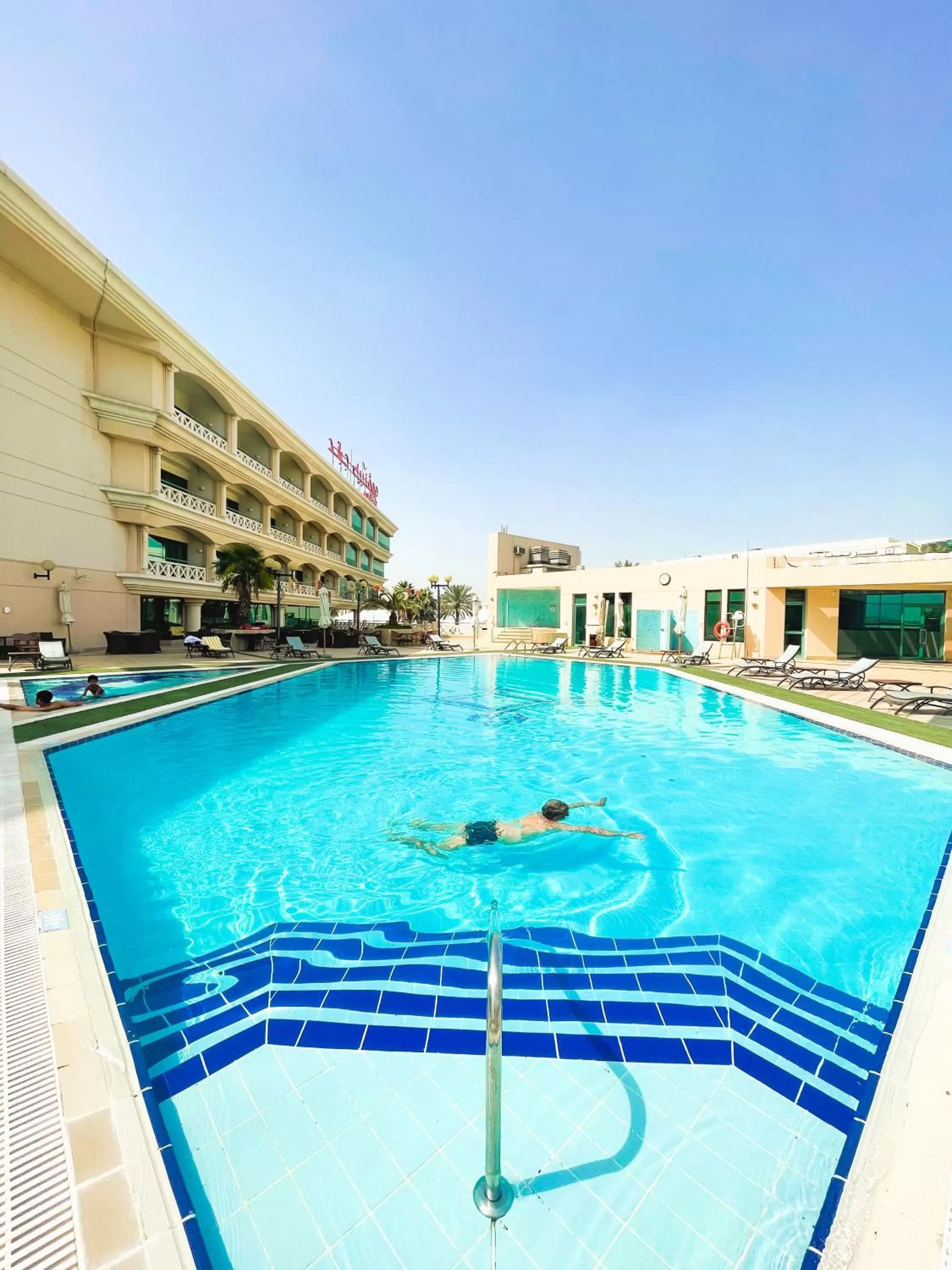 Swimming pool in Mövenpick Grand Al Bustan