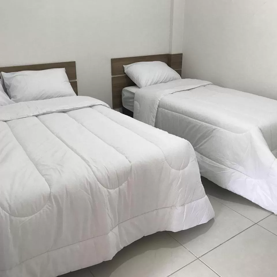 Bed in Leati's Hotel