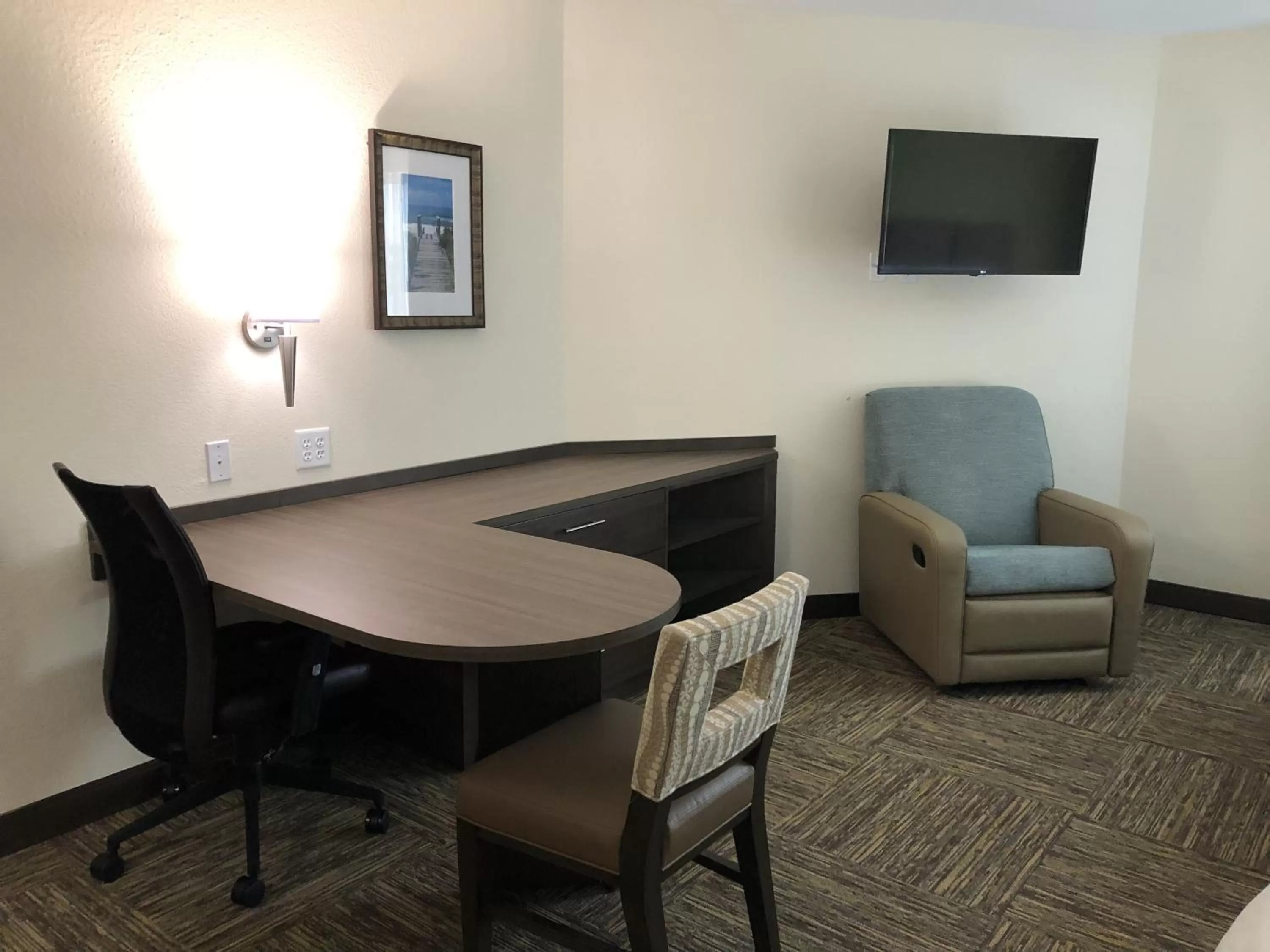 Seating area in Candlewood Suites - Panama City Beach Pier Park by IHG