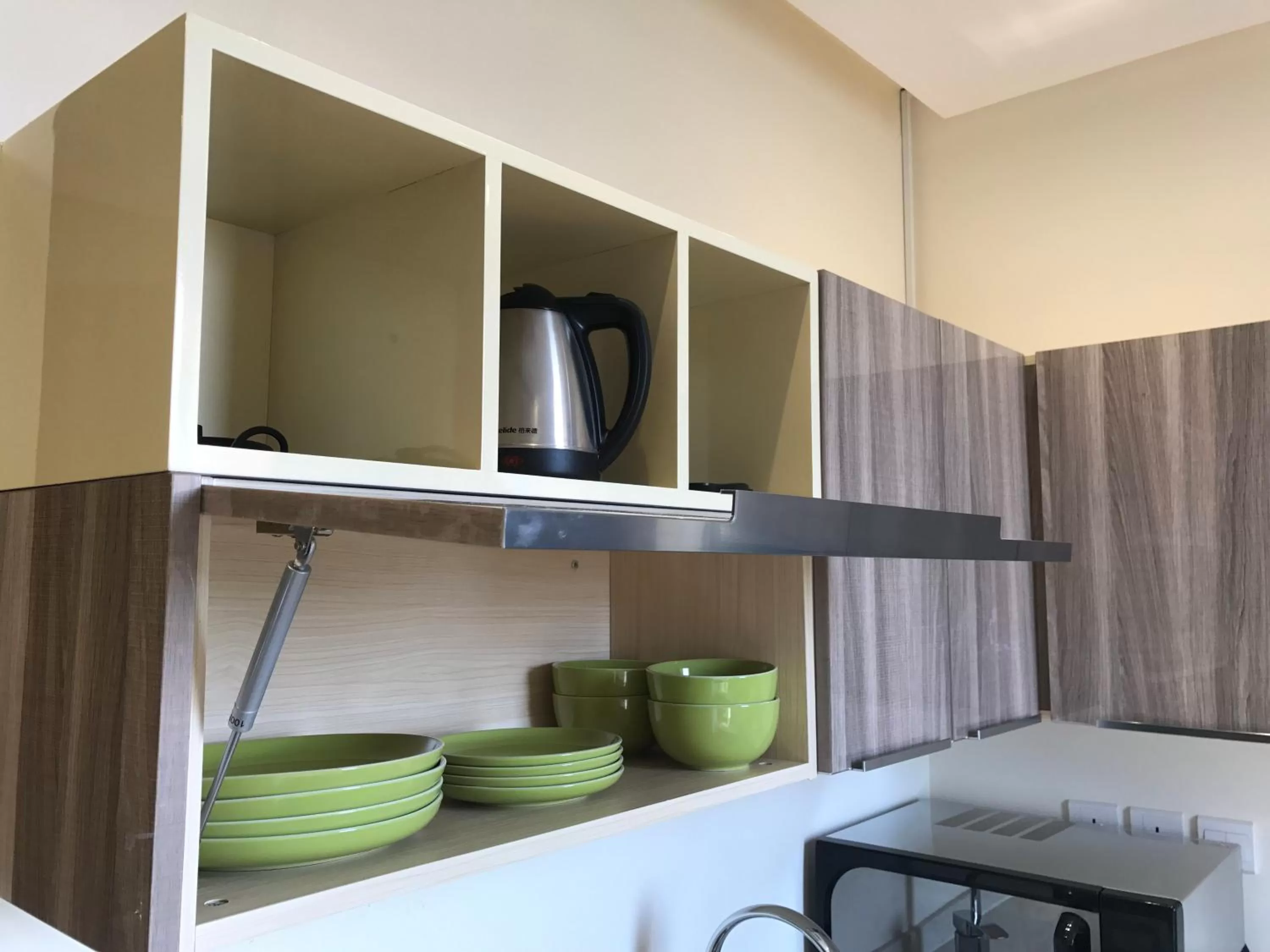Kitchen or kitchenette, Bed in Nooryana Suites Boutique