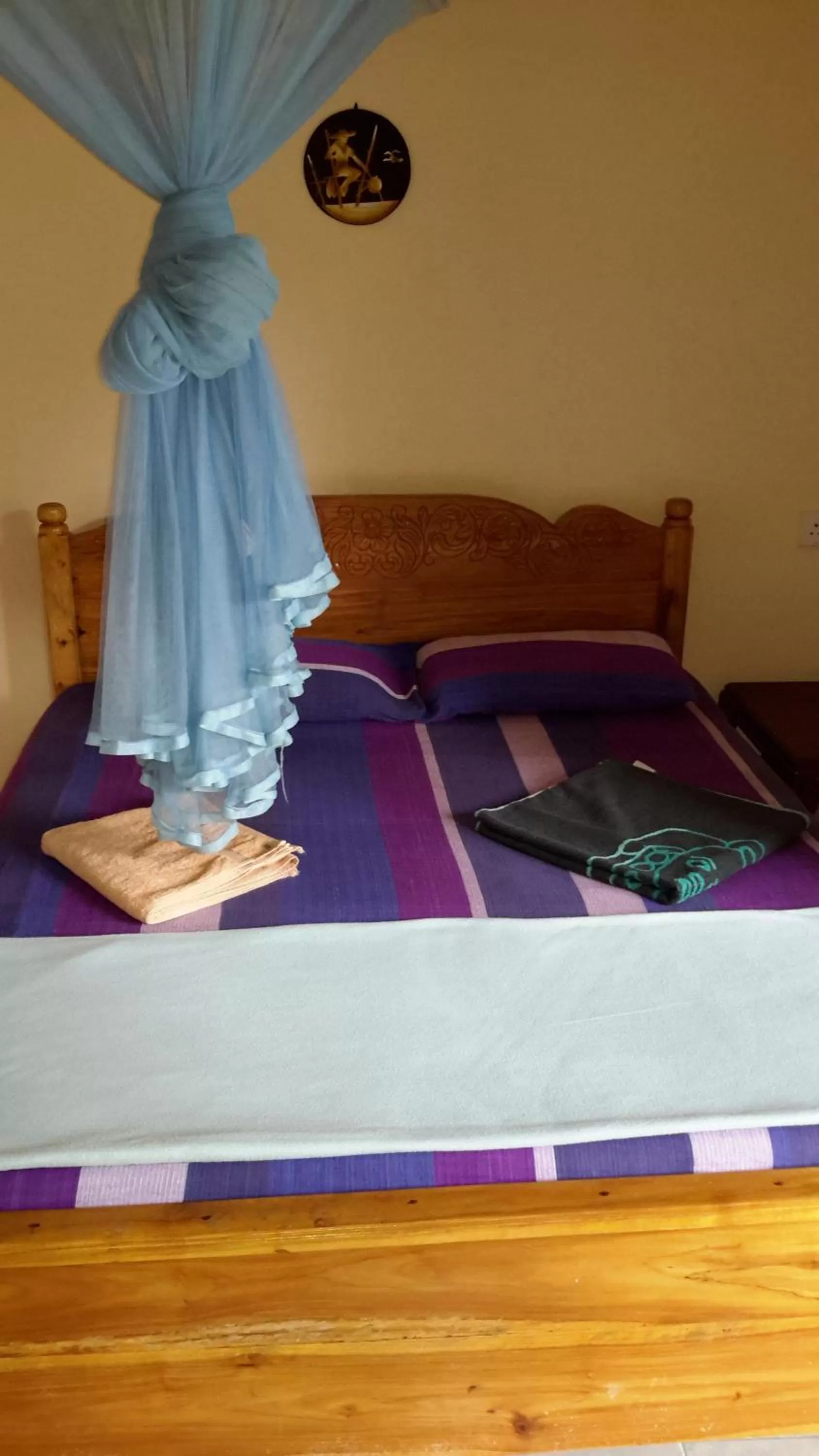 Bed in Raveena Guest House