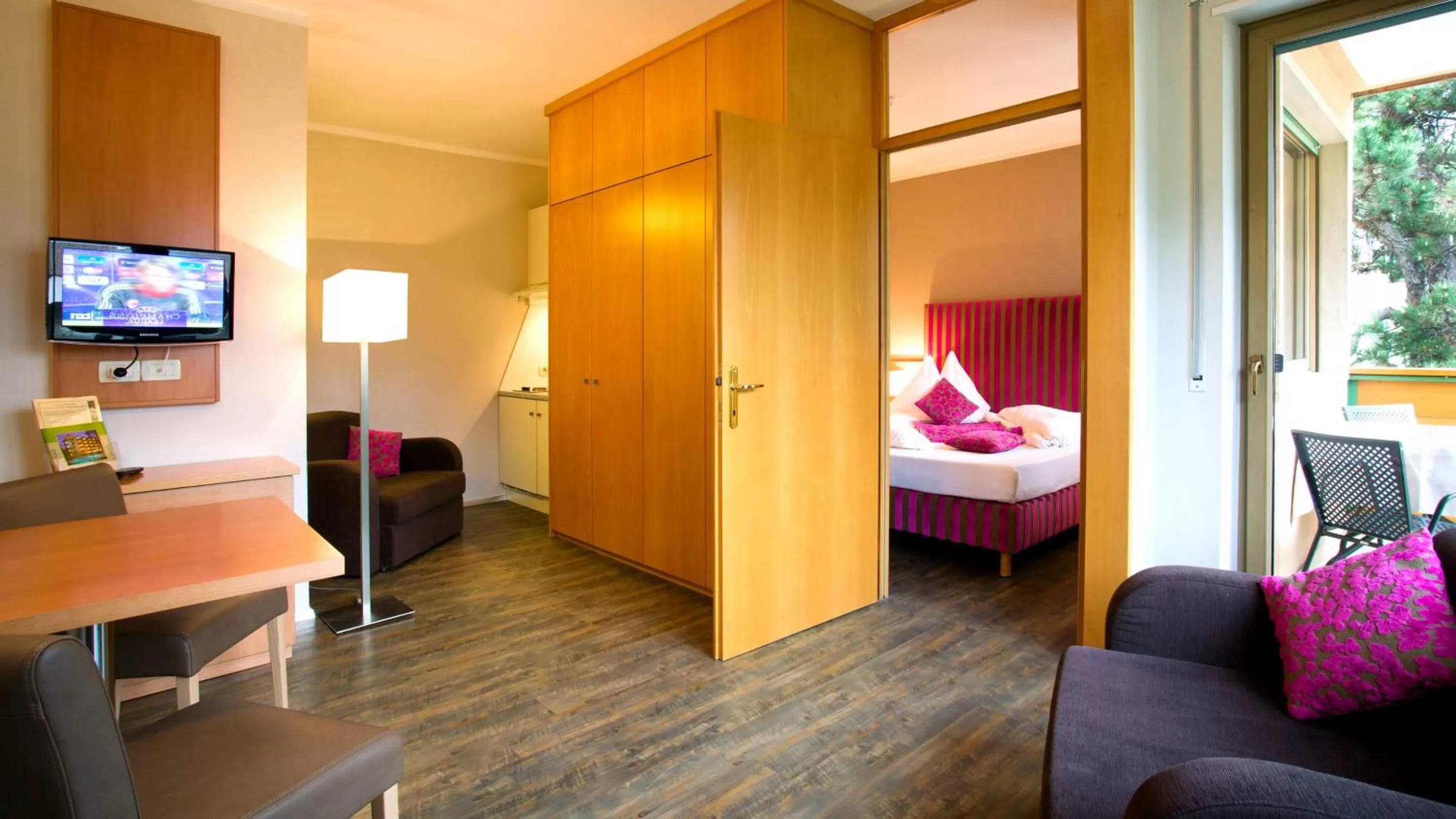 Photo of the whole room, TV/Entertainment Center in Flora Hotel & Suites