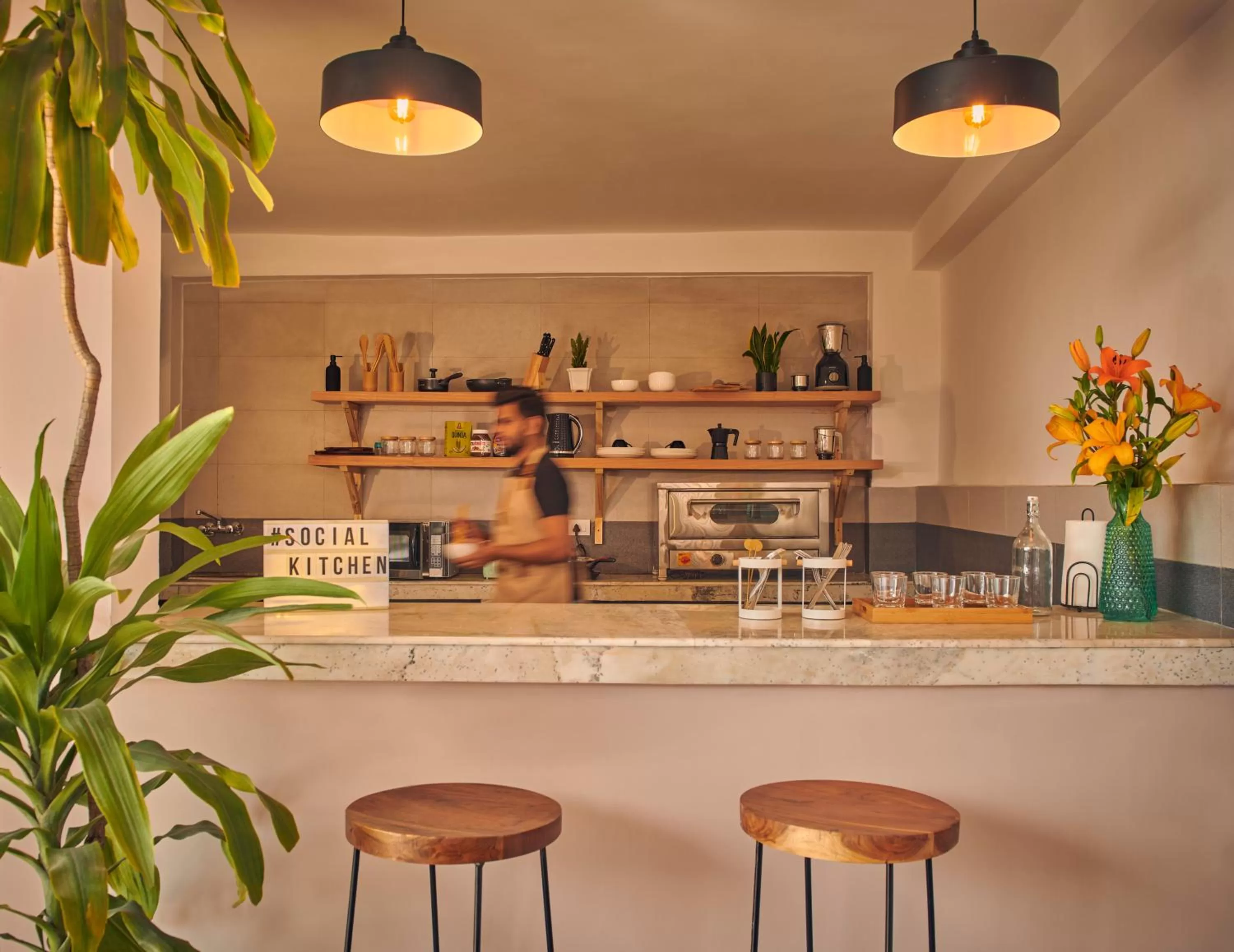 Communal kitchen in Minimalist Poshtel & Suites