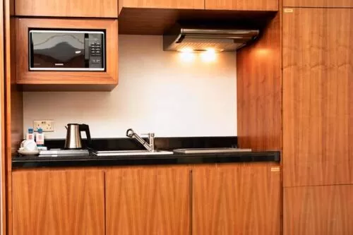 Kitchen or kitchenette in Century Hotel Doha