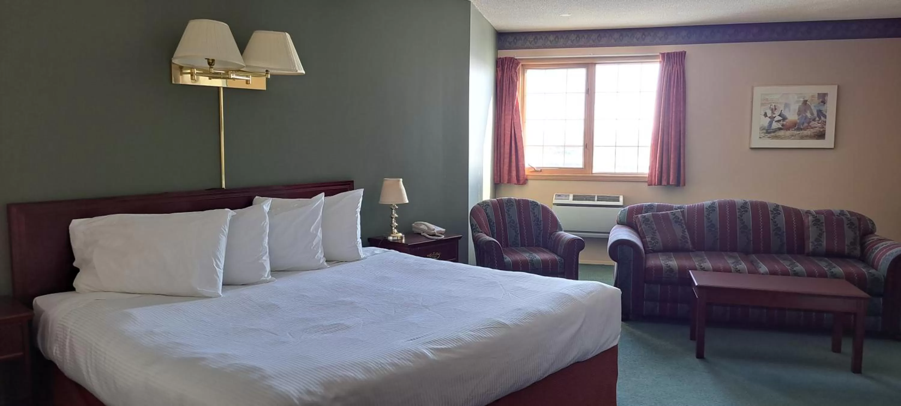 Seating area, Bed in Travelodge by Wyndham Lacombe