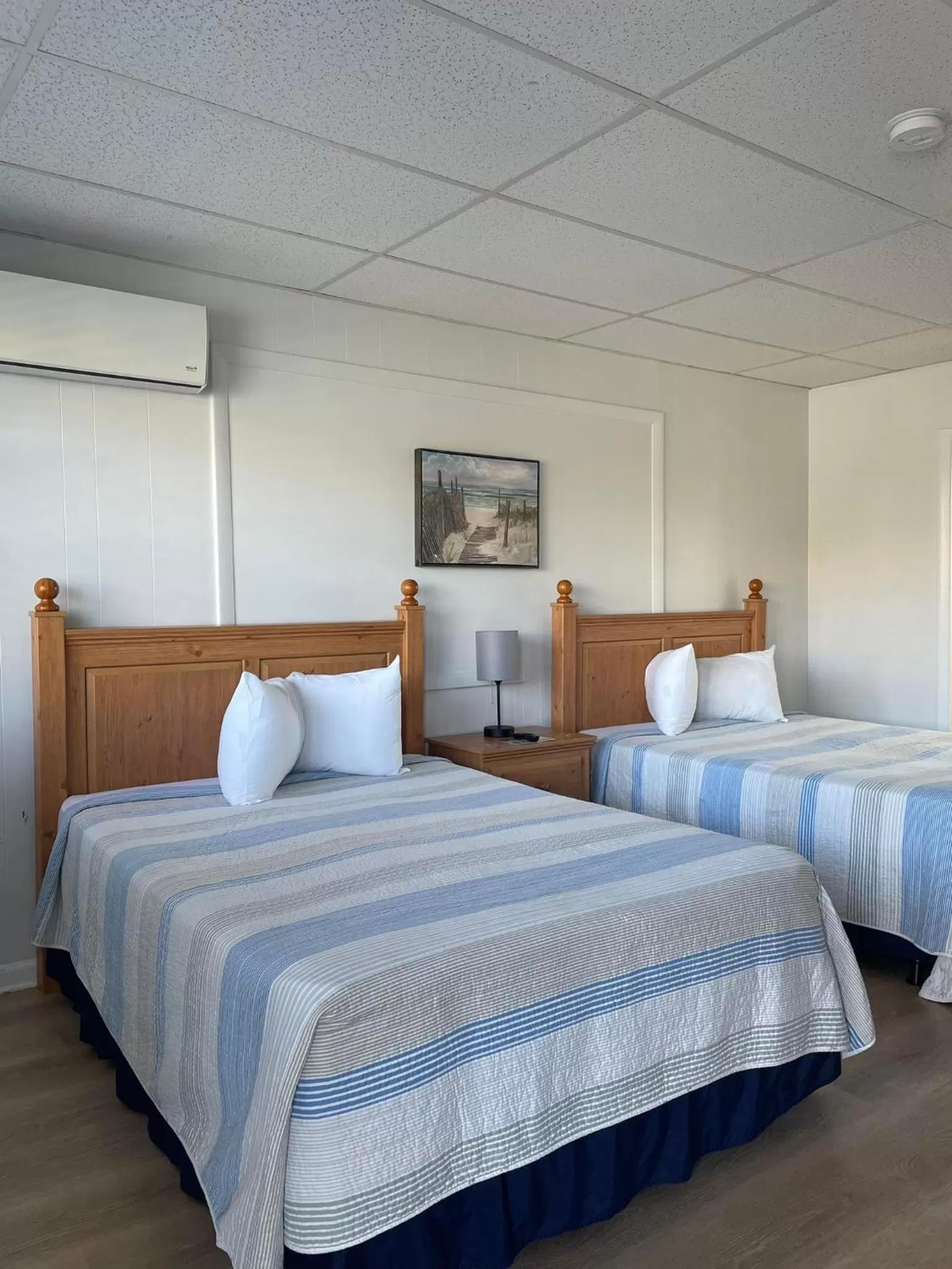 Bed in The Grand Beach Inn