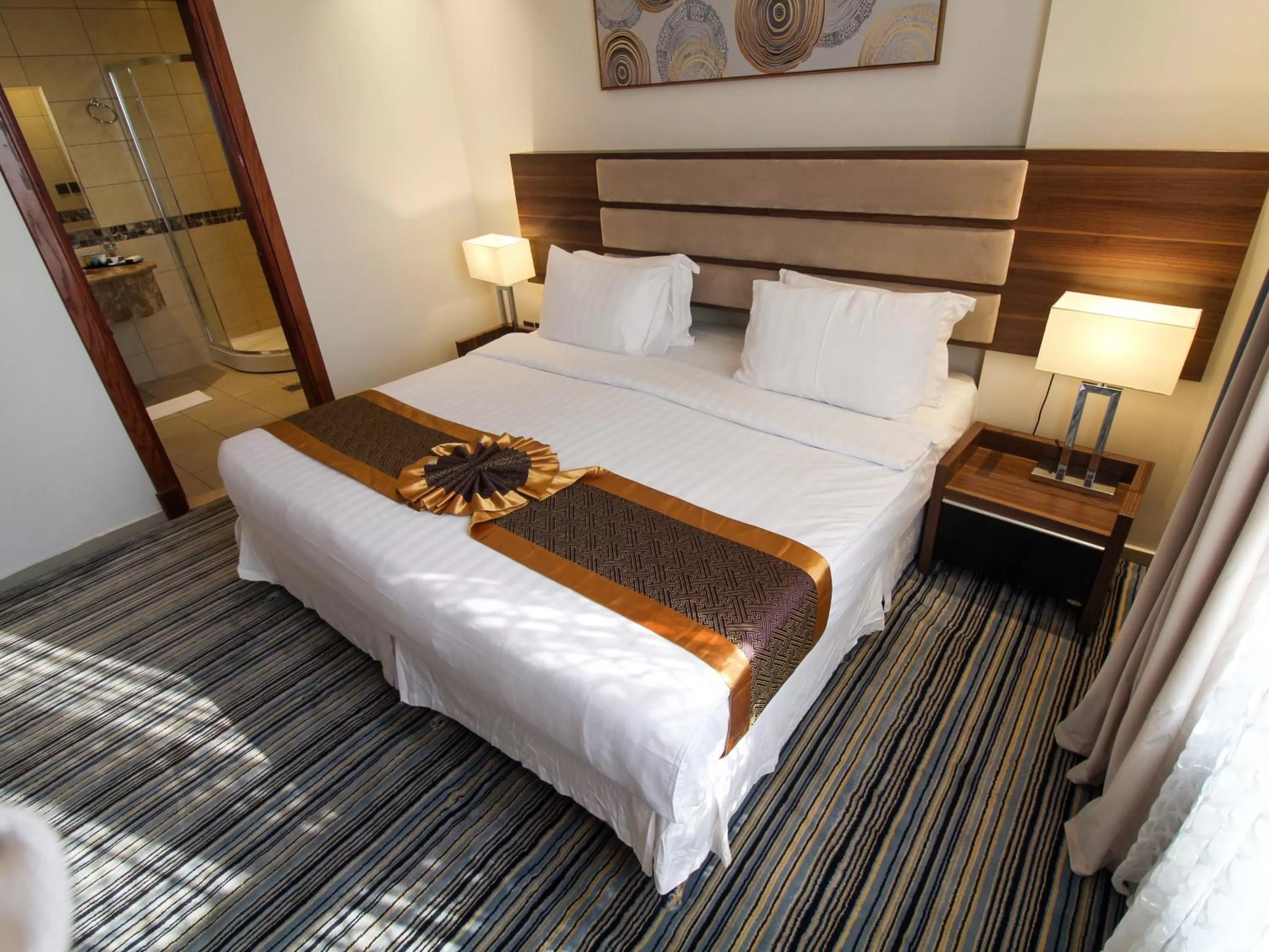 Bed in Friesian Hotel Suites