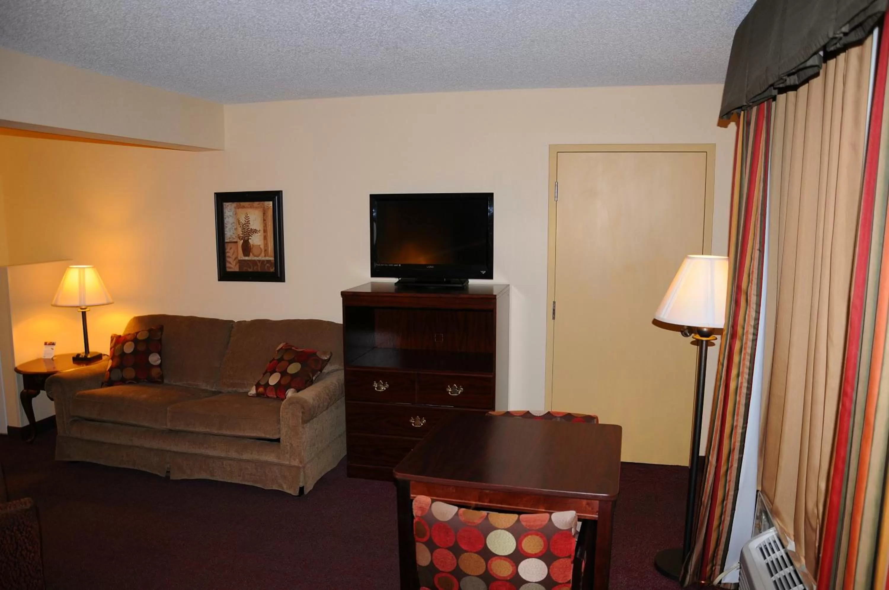 Photo of the whole room, TV/Entertainment Center in Super 8 by Wyndham Lamar