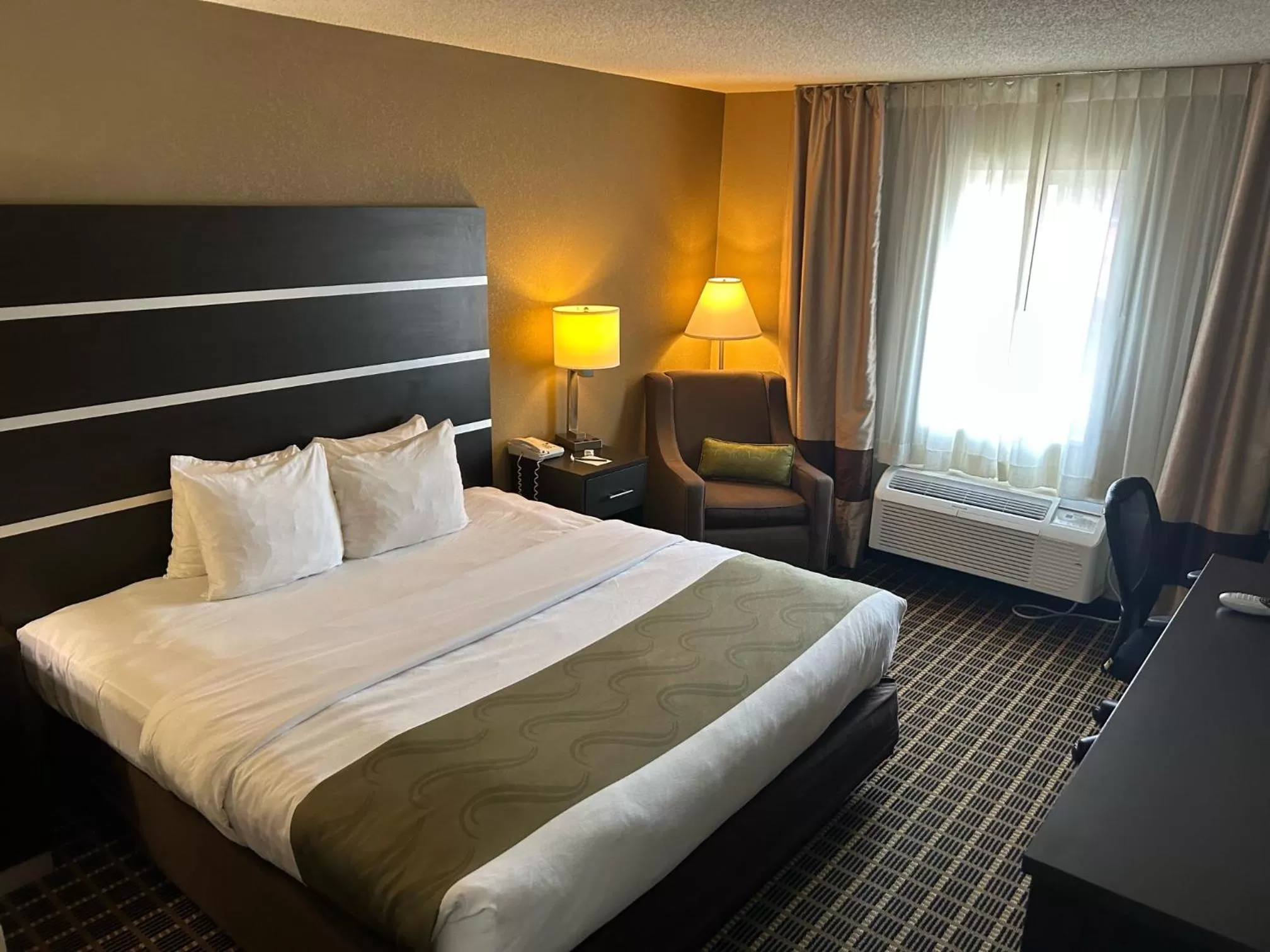 Bed in Quality Inn & Suites