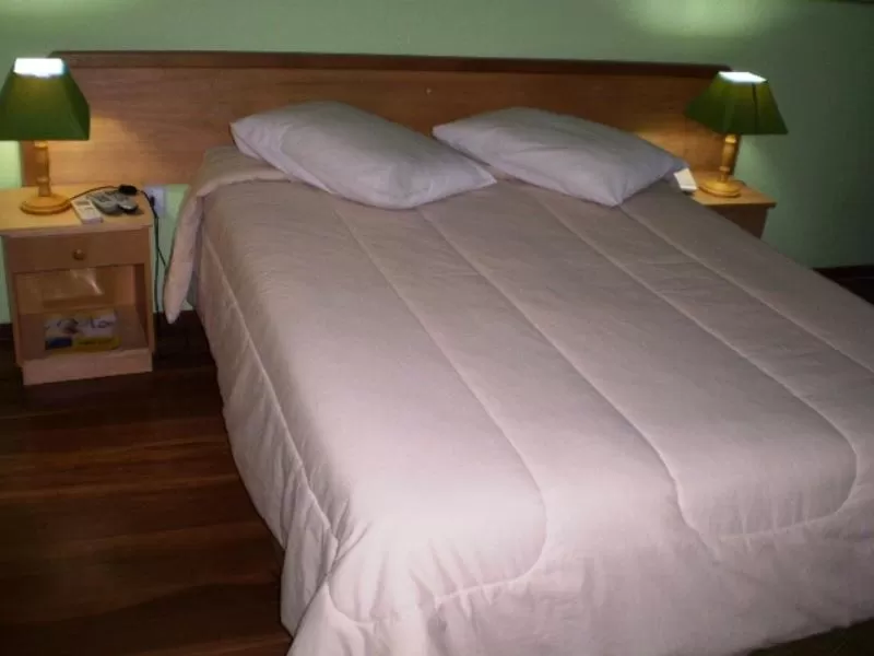Bed in Hotel Gravataí Center