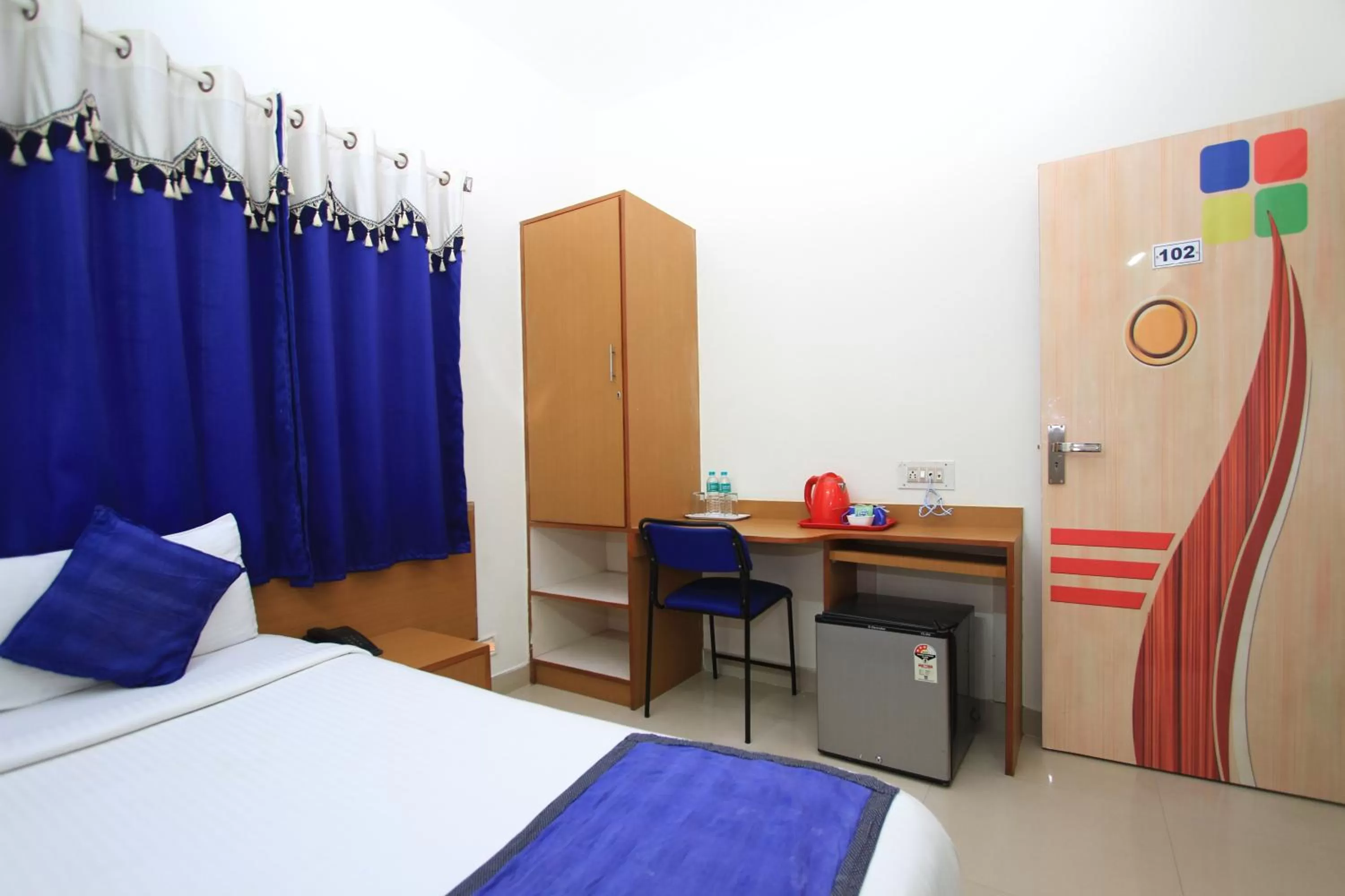 Bed in Arra Suites kempegowda Airport Hotel