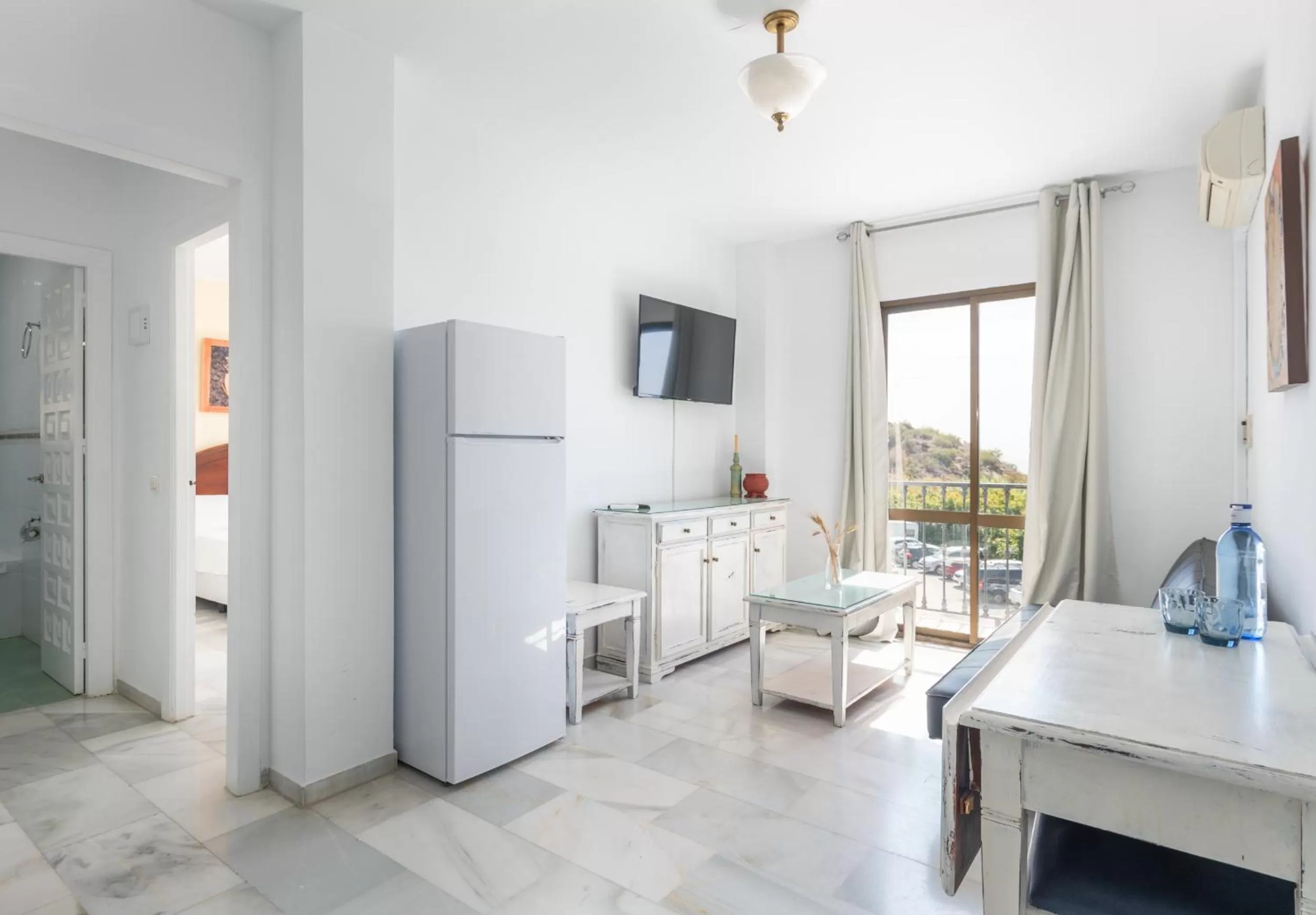 Lounge or bar in Apartahotel Playamaro by Dorobe