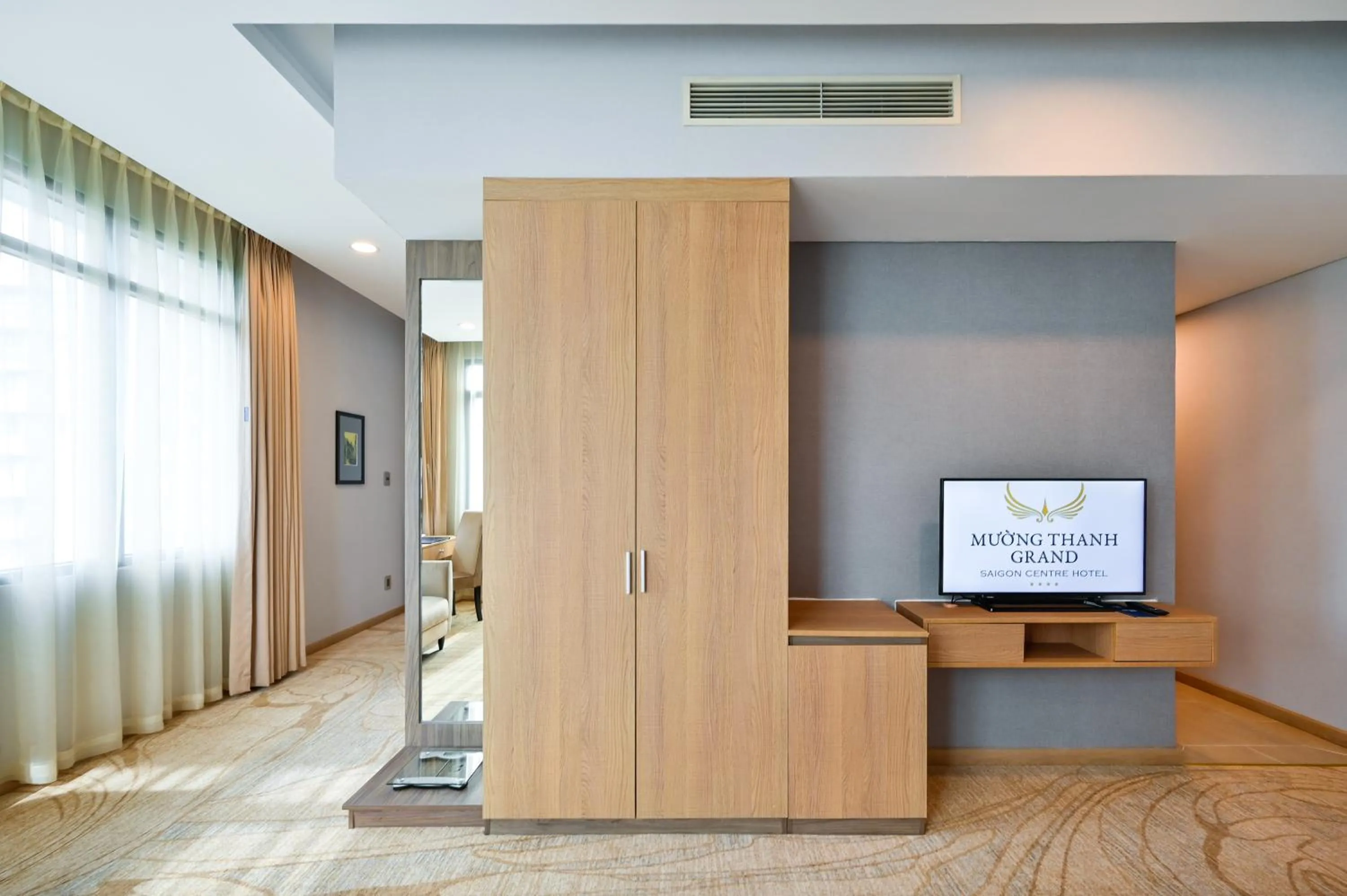 Communal lounge/ TV room in Muong Thanh Grand Saigon Centre Hotel