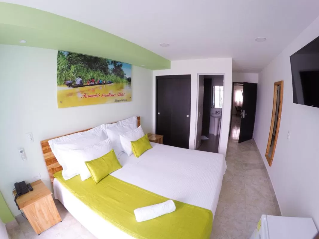 Bed in Kamaleb Farallones Hotel