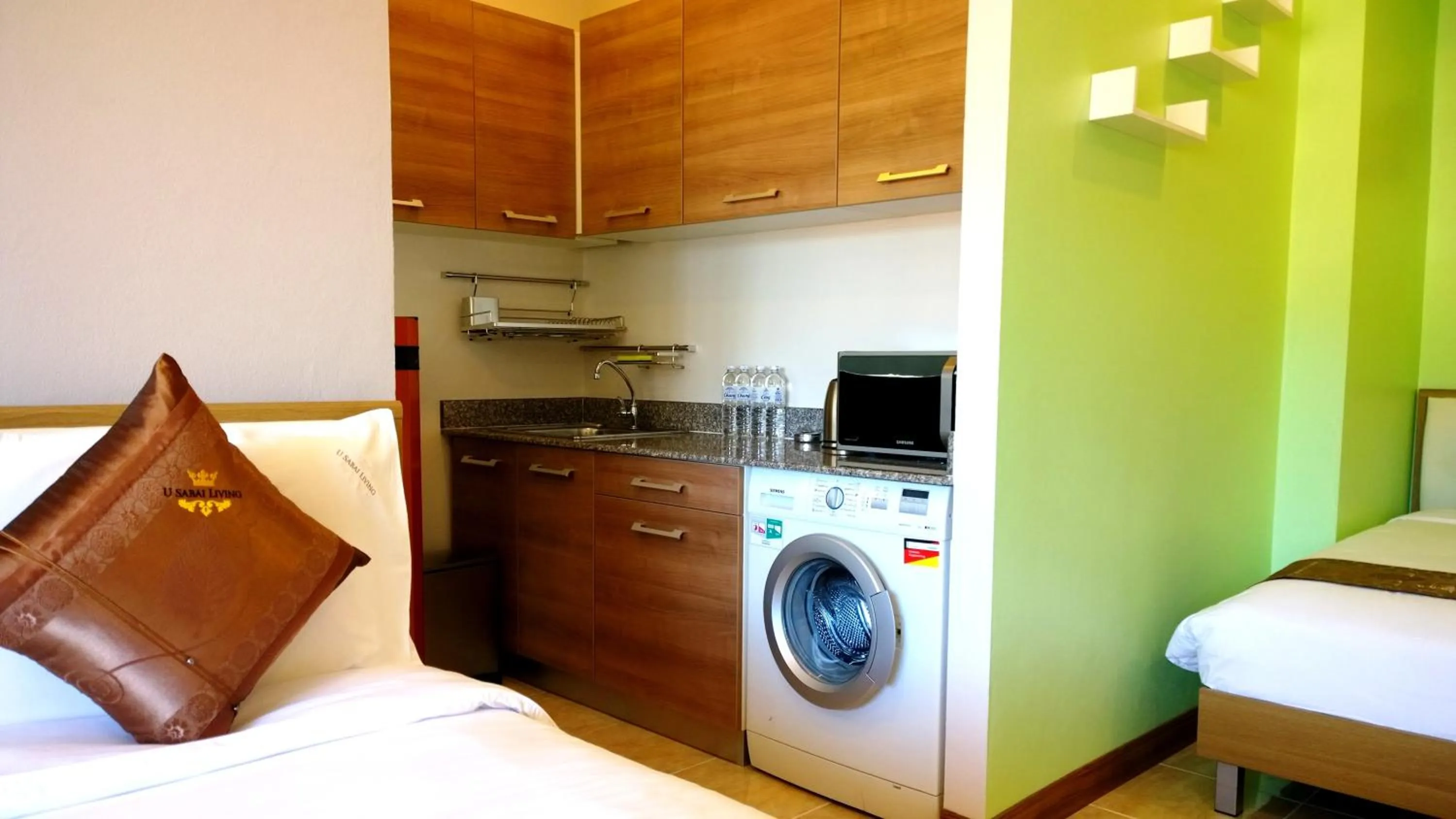 Kitchen or kitchenette, Bed in U Sabai Living Hotel