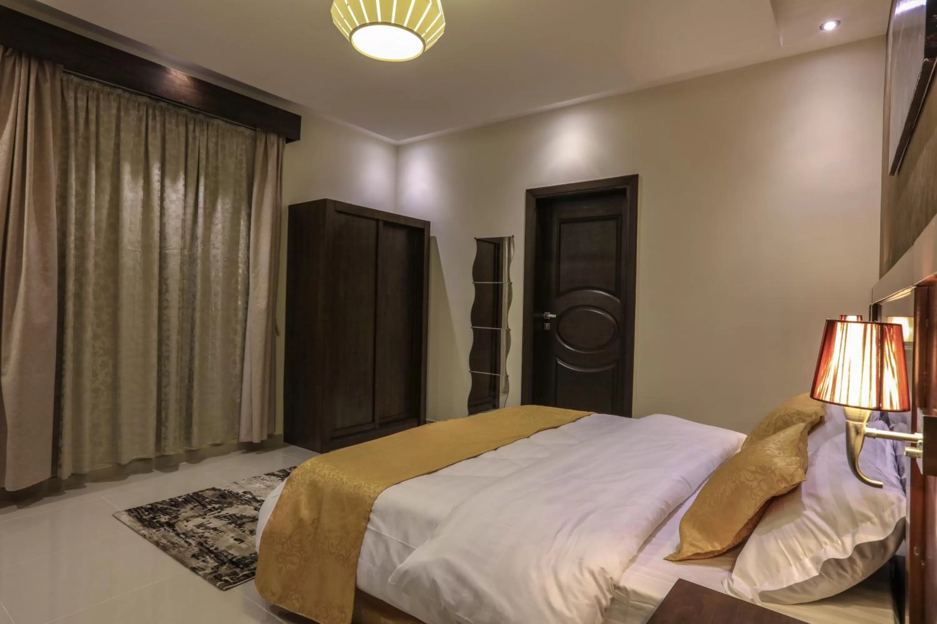 Bed in Al Itqan Apart-hotel