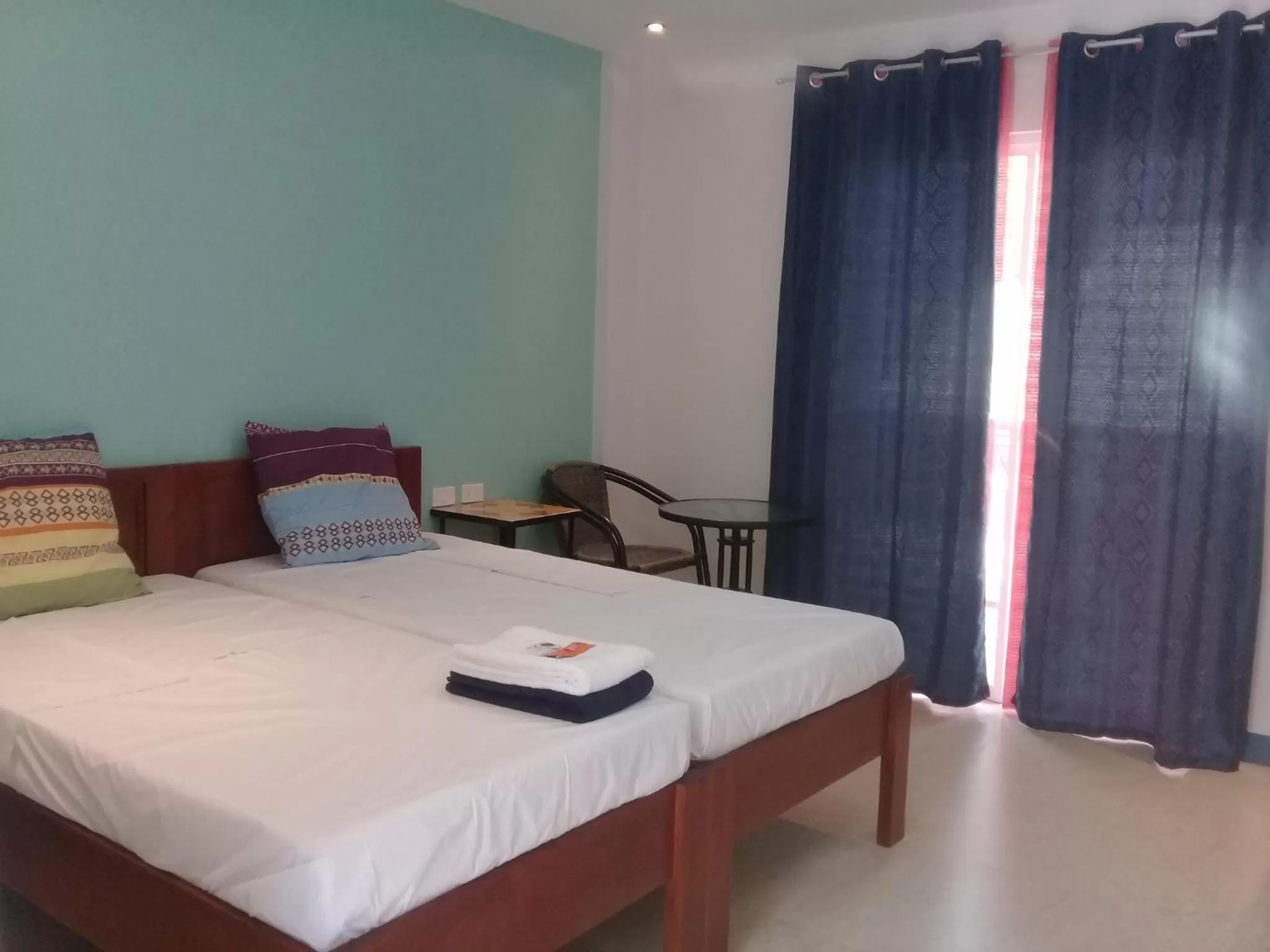 Bed in D & B BLUESTAR BEACH RESORT