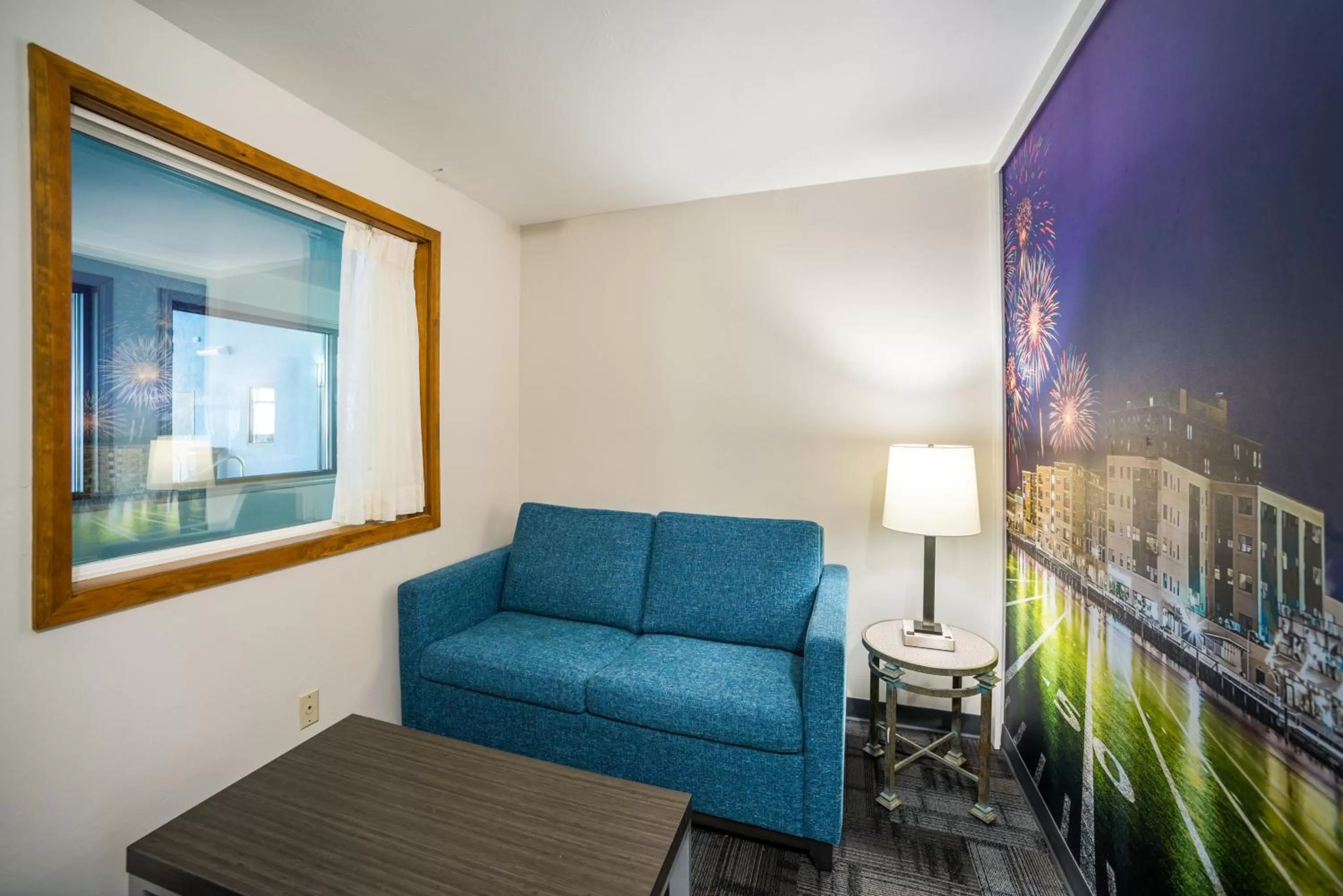 Living room in AmericInn by Wyndham Green Bay Near Stadium