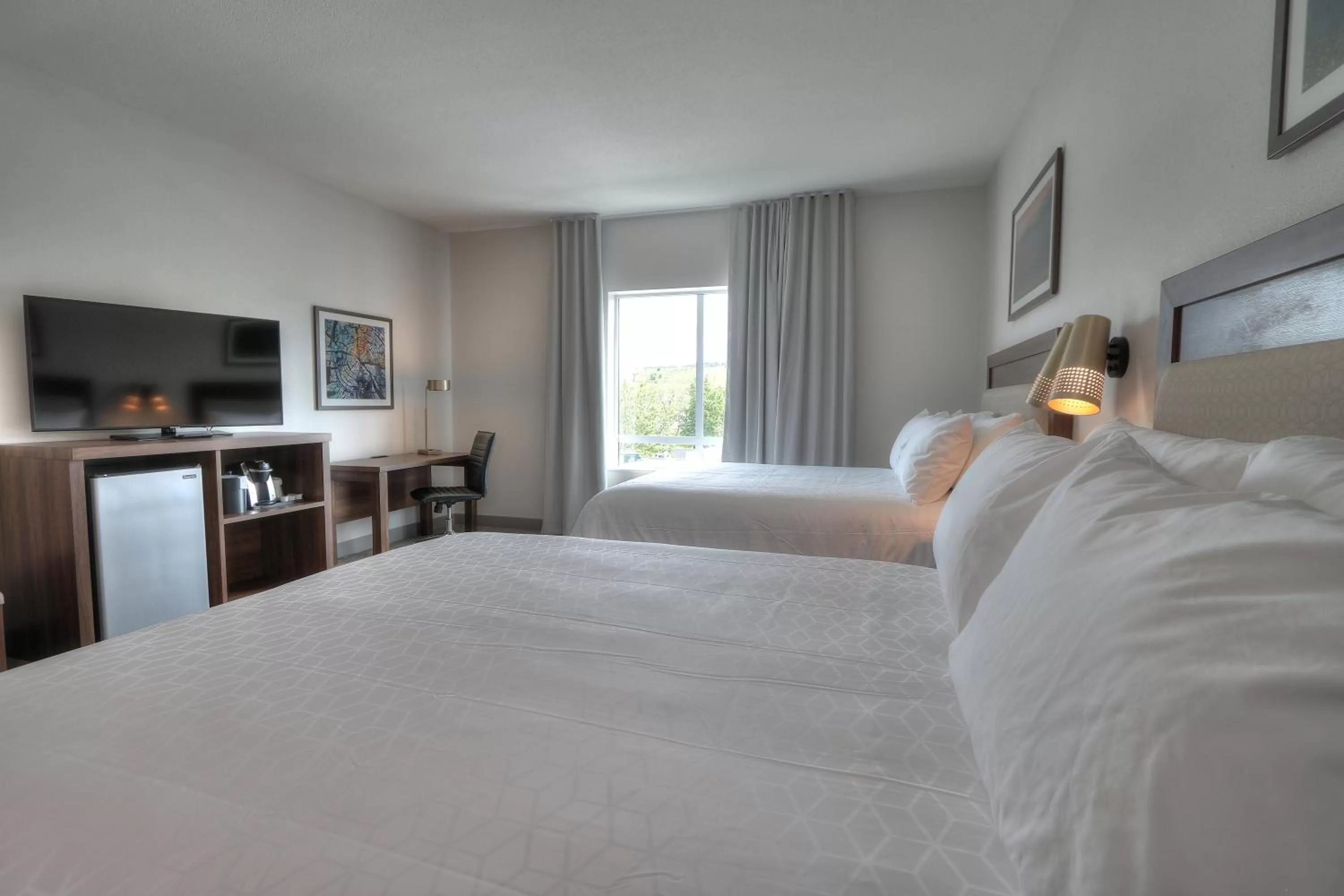 Photo of the whole room, Bed in Holiday Inn & Suites Pigeon Forge Convention Center by IHG