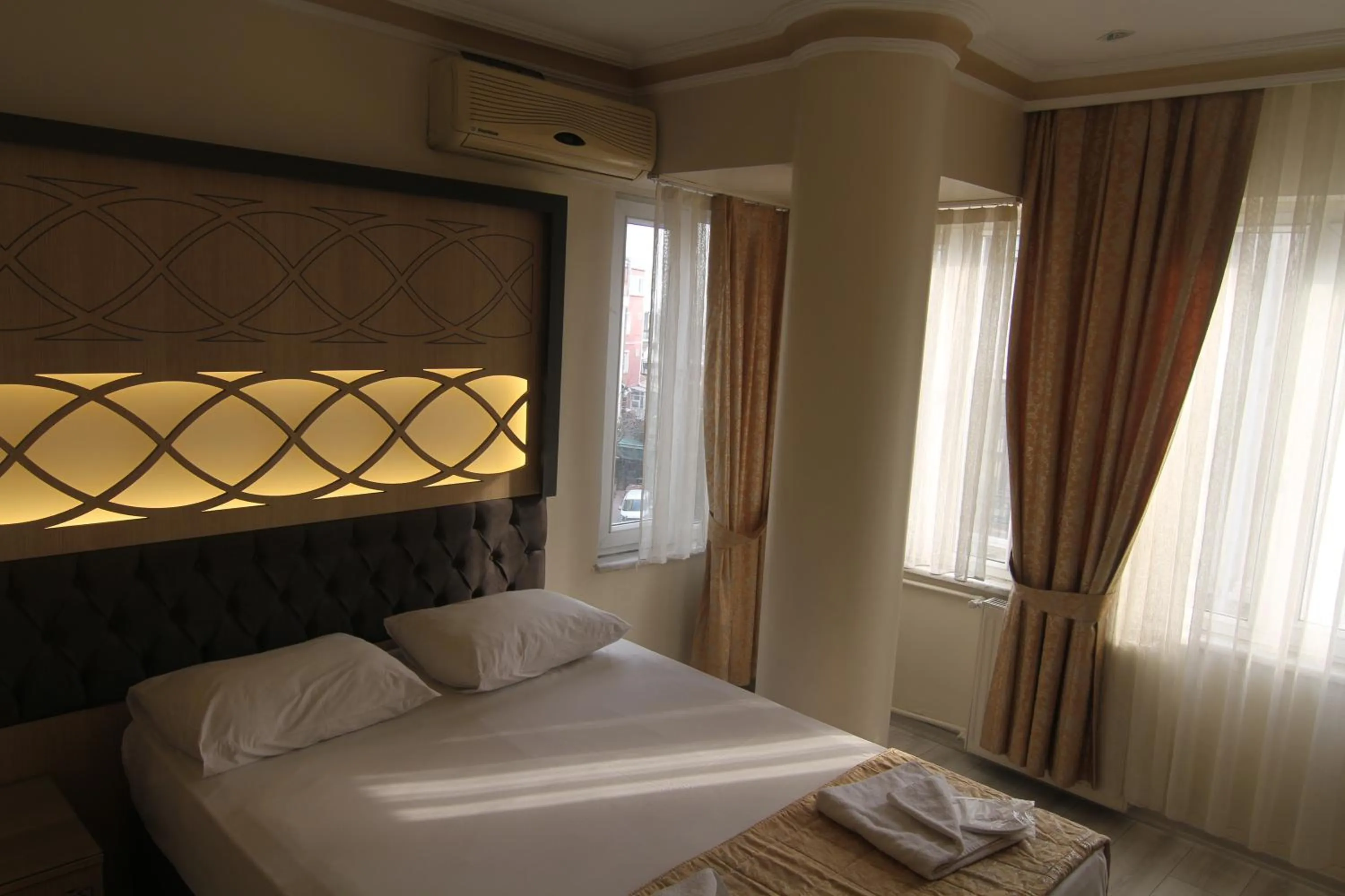 Bedroom, Bed in Grand Liza Hotel