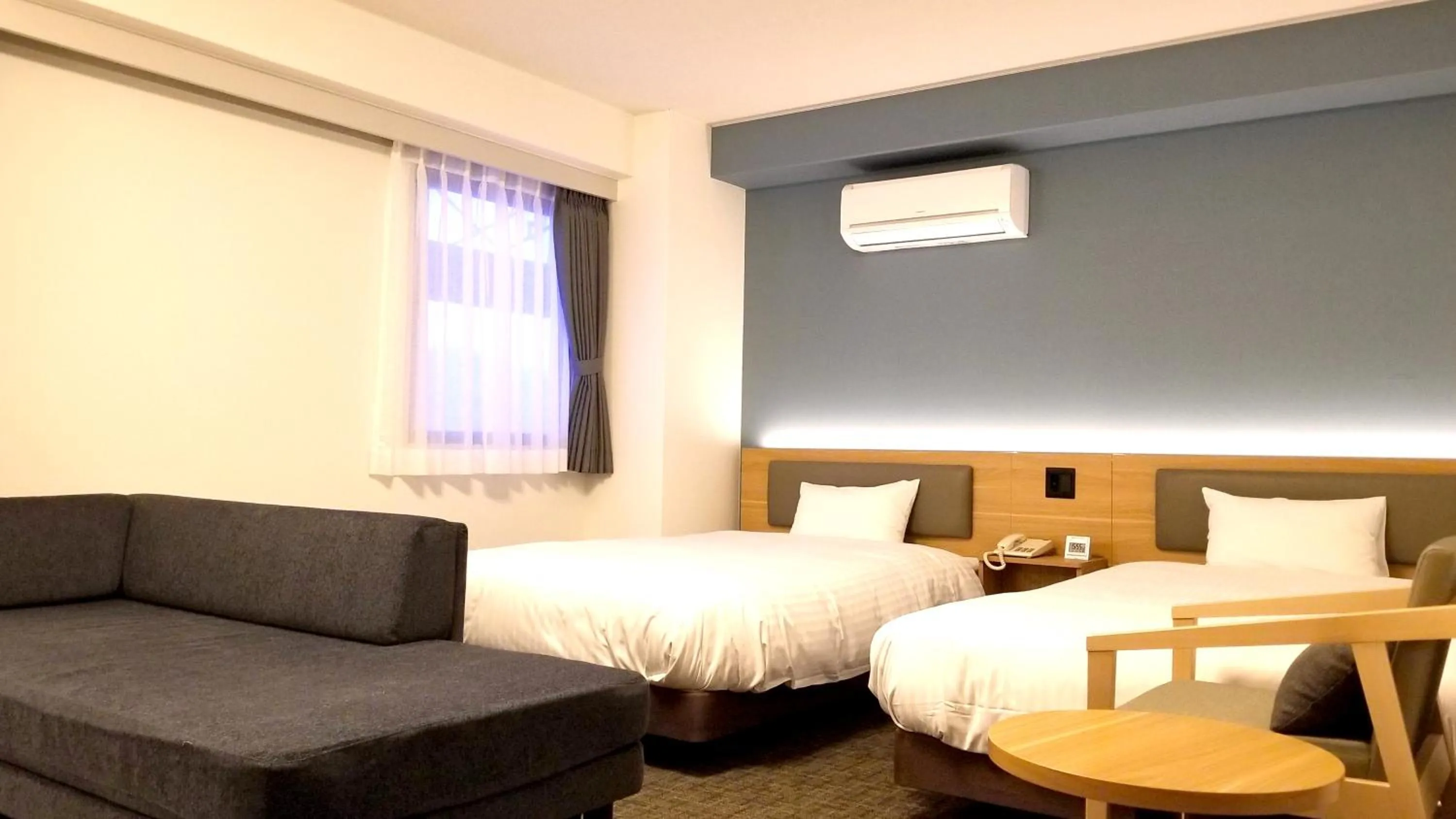 Bed in Kochi Sunrise Hotel