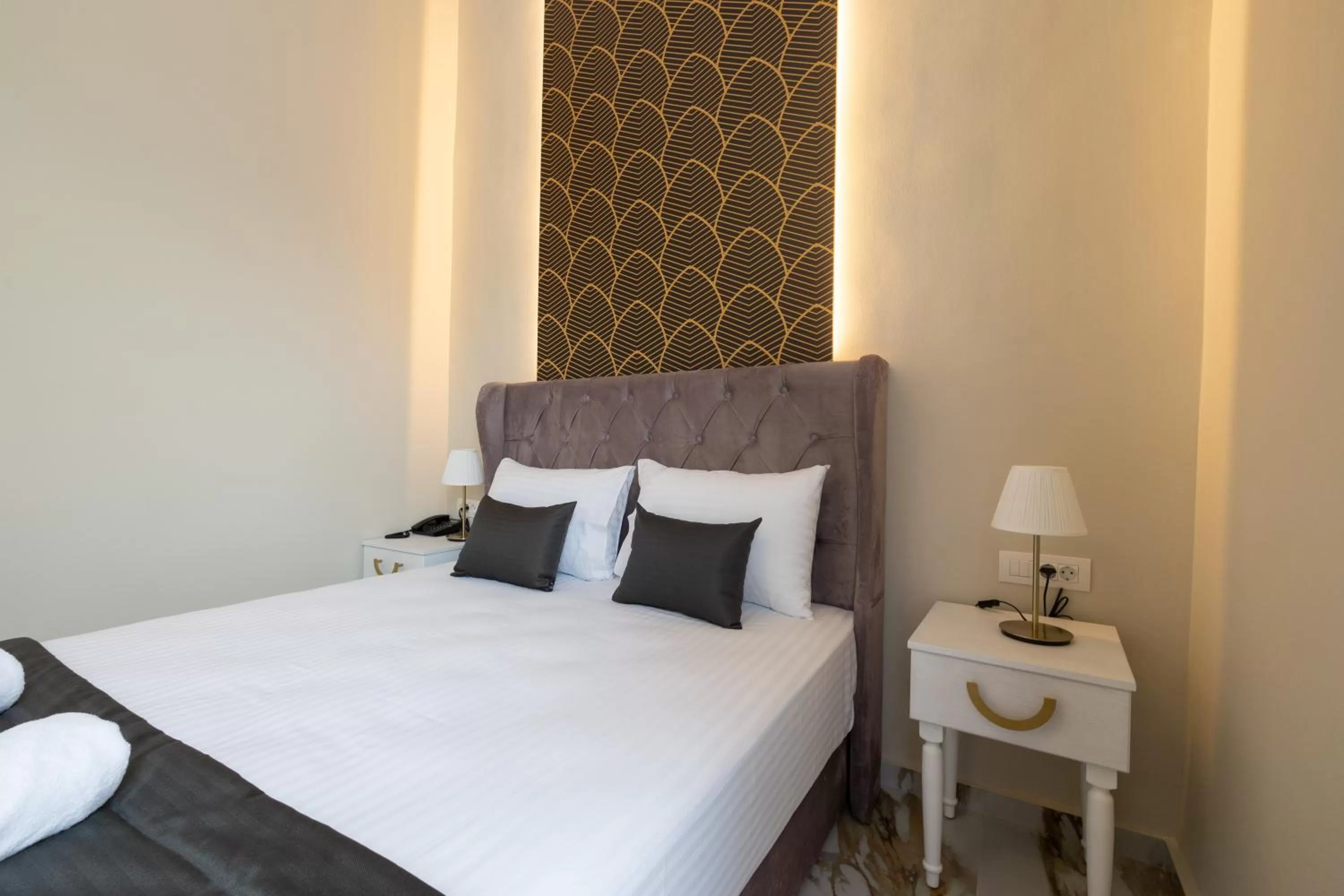 Bed in Modern Revival Luxury Hotel