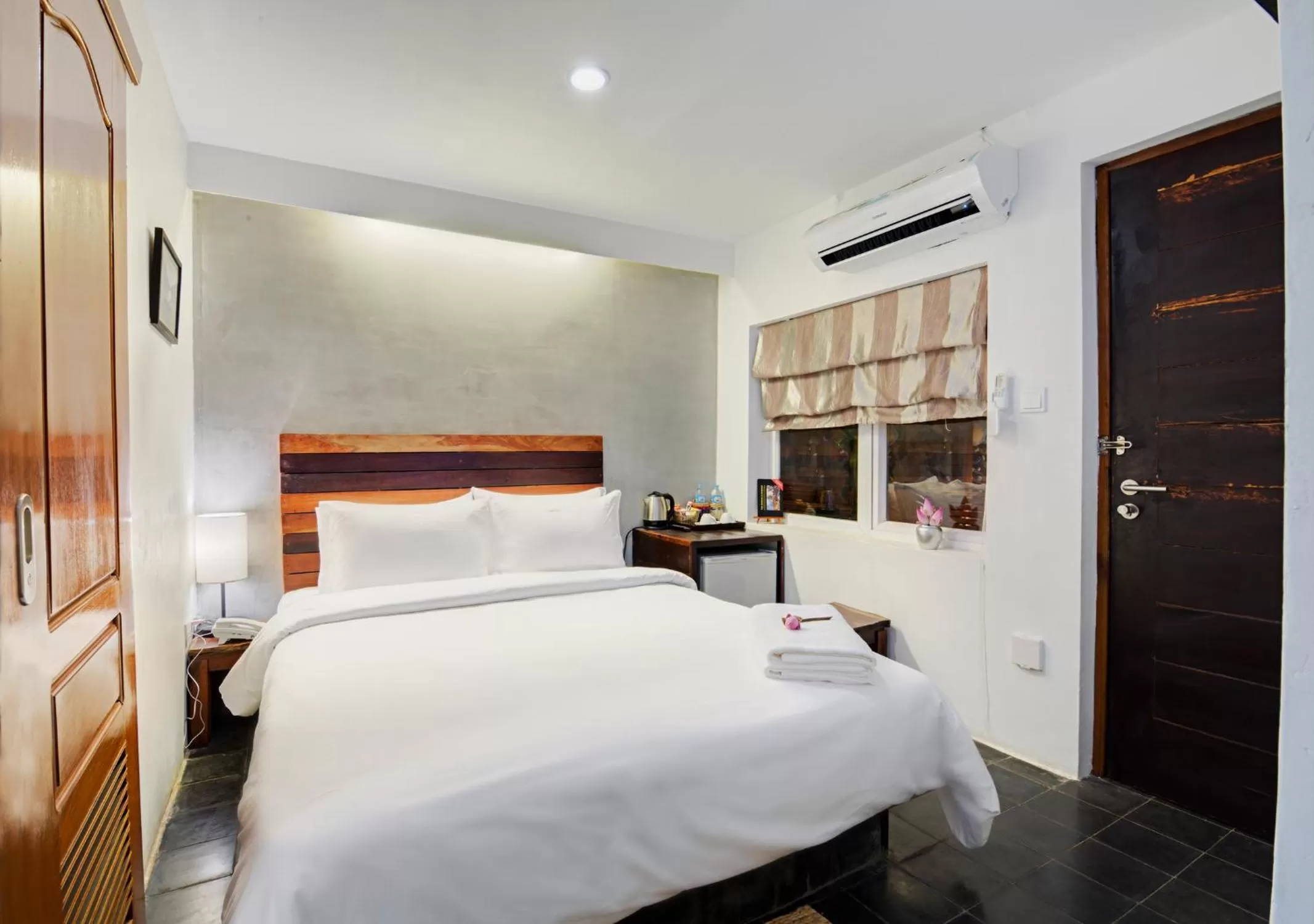 Bed in Maison Model d'Angkor