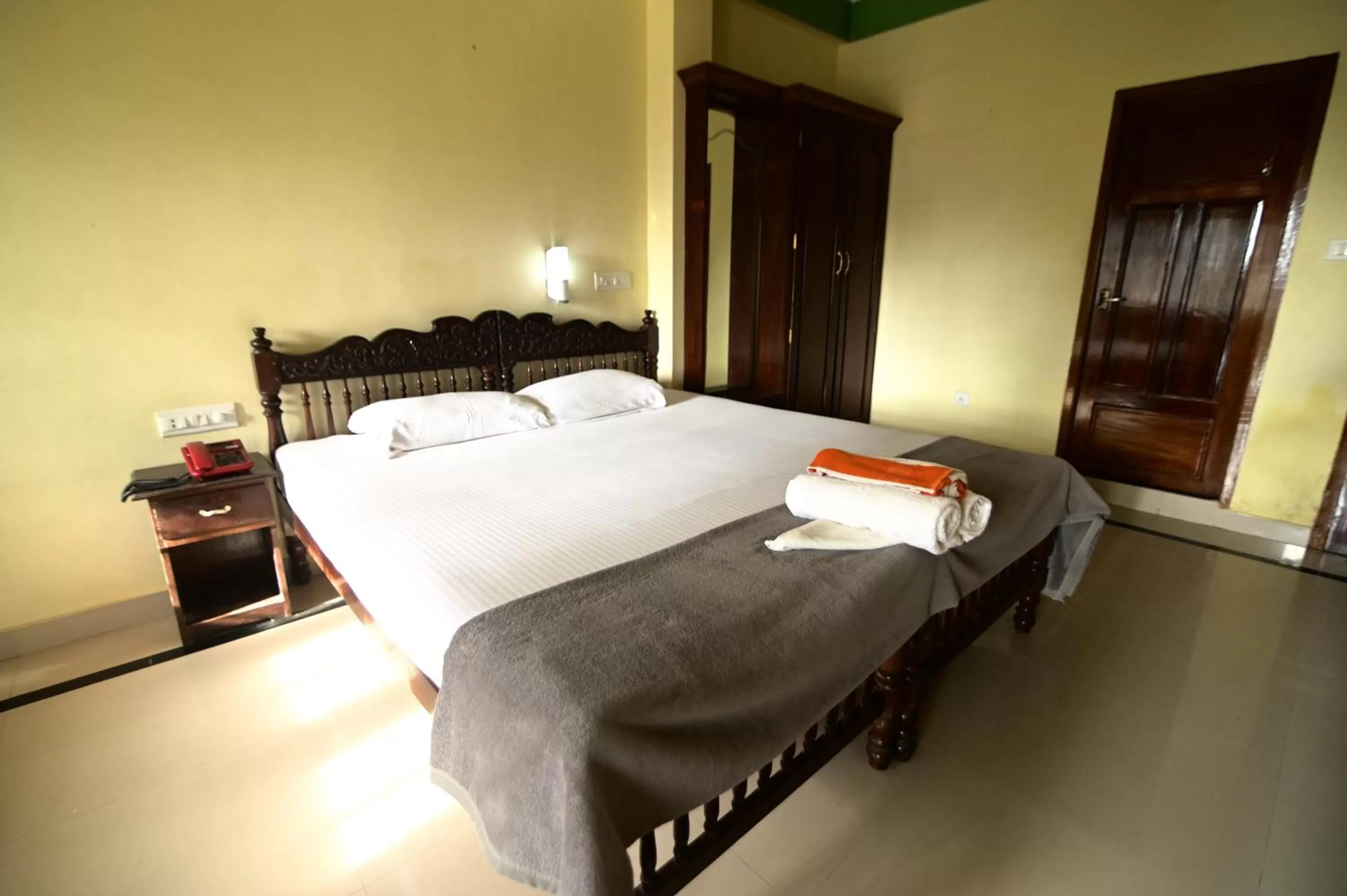 Bed in Sree Mookambika Beach Resort