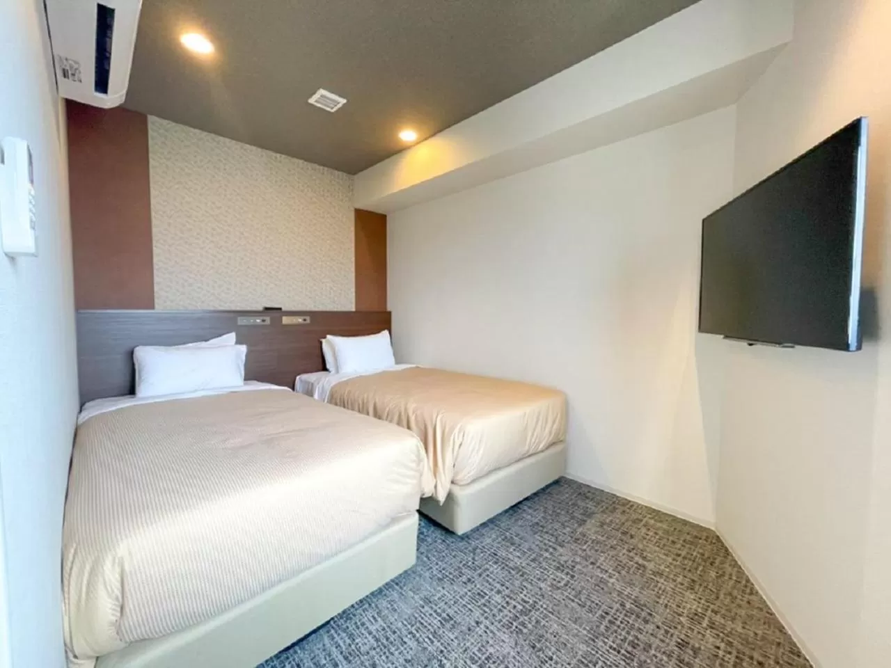 Bed in HOTEL LiVEMAX BUDGET Nagoya Shinkansen-guchi