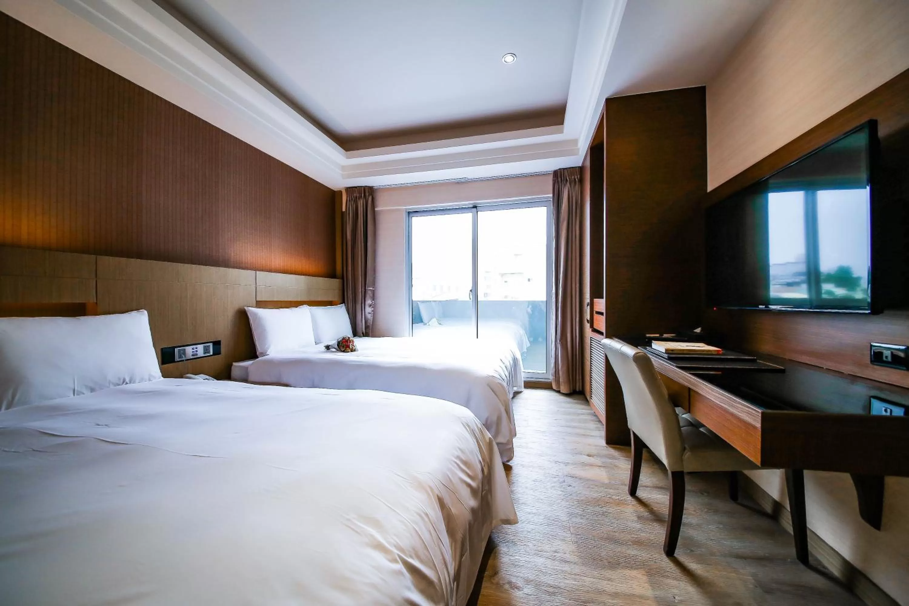 Photo of the whole room, Bed in Talmud Hotel Tainan