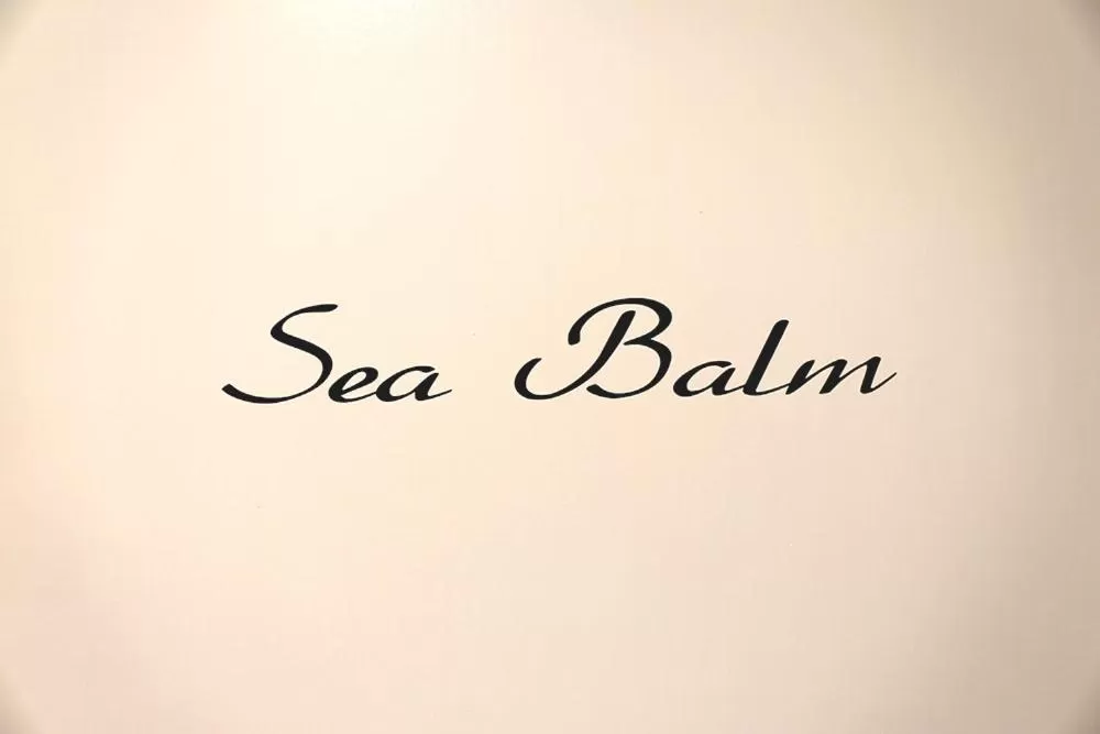 Property logo or sign in Le Coq Suites