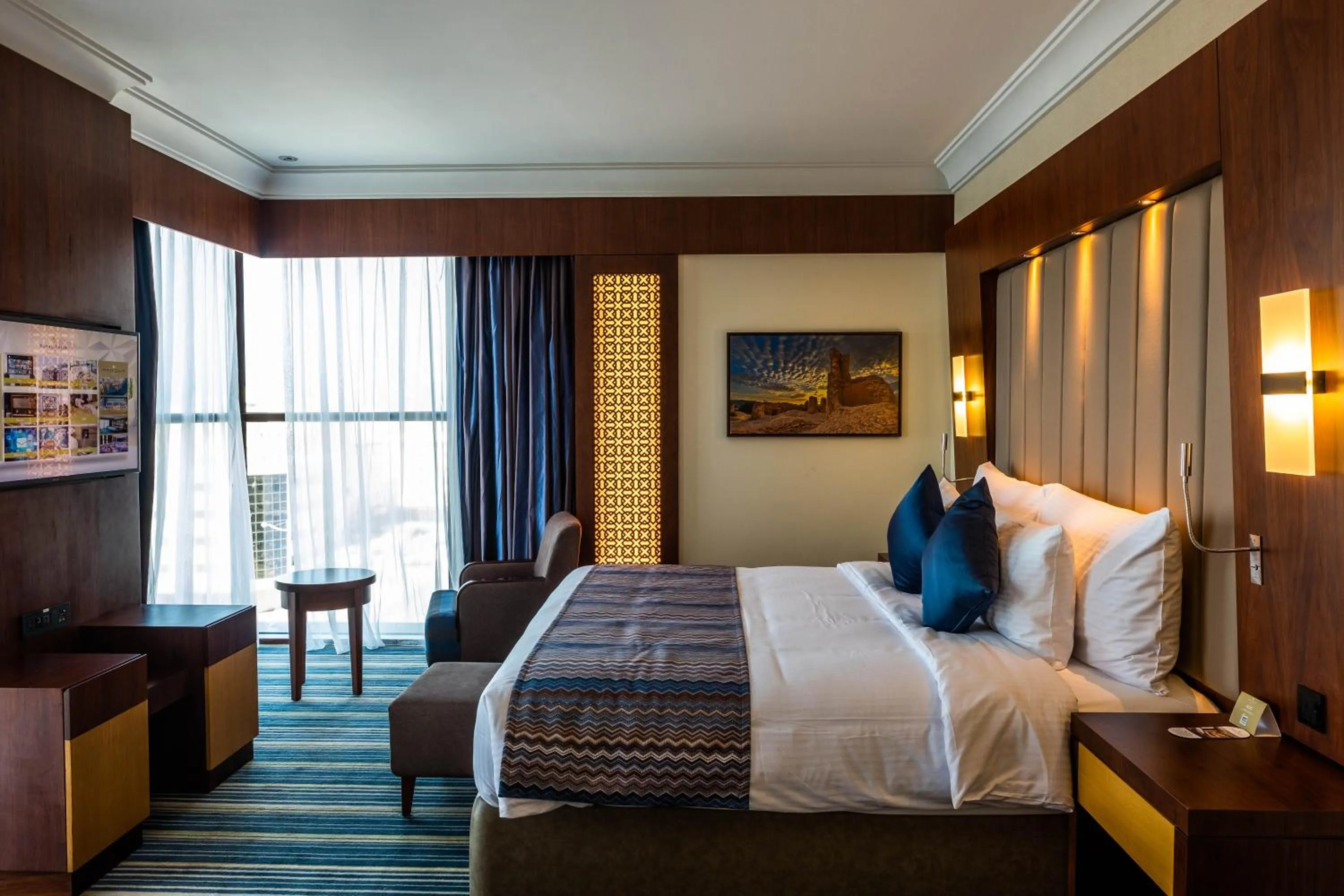 Photo of the whole room, Bed in Royal Tulip Muscat