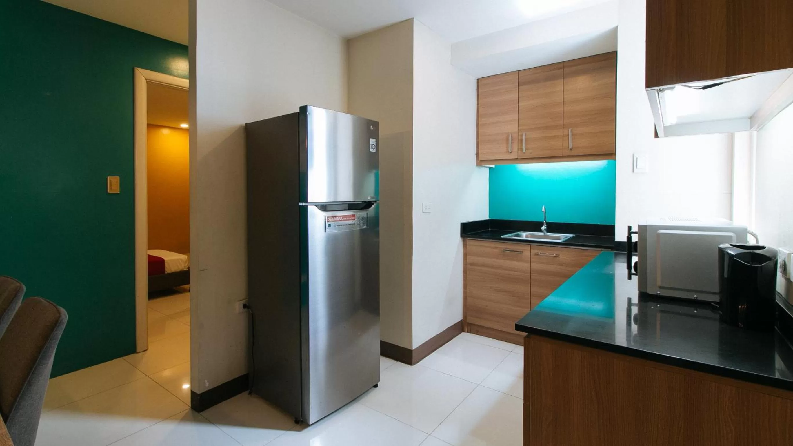 Kitchen or kitchenette in RedDoorz Plus at Kamuning Quezon City