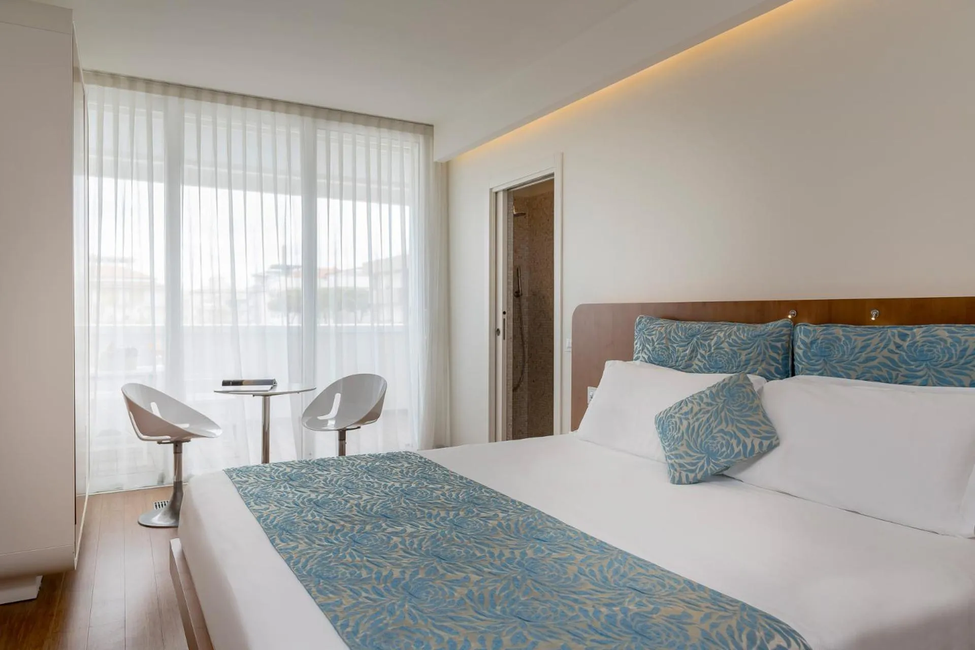 Bed in T-Suite Hotel