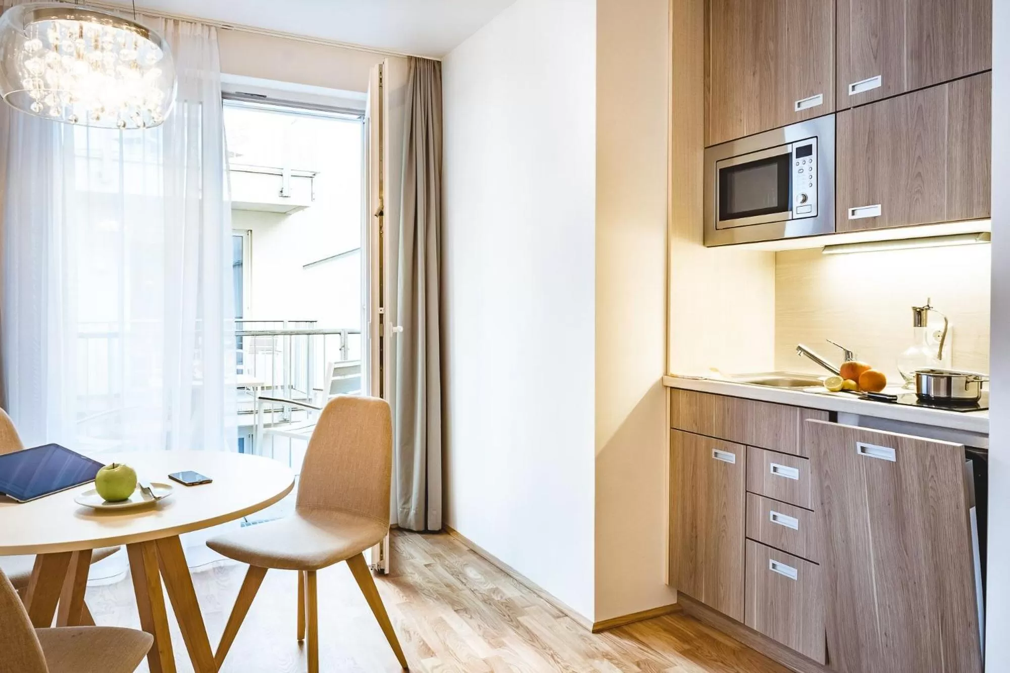 Kitchen or kitchenette in Oliver Apartments | contactless check-in
