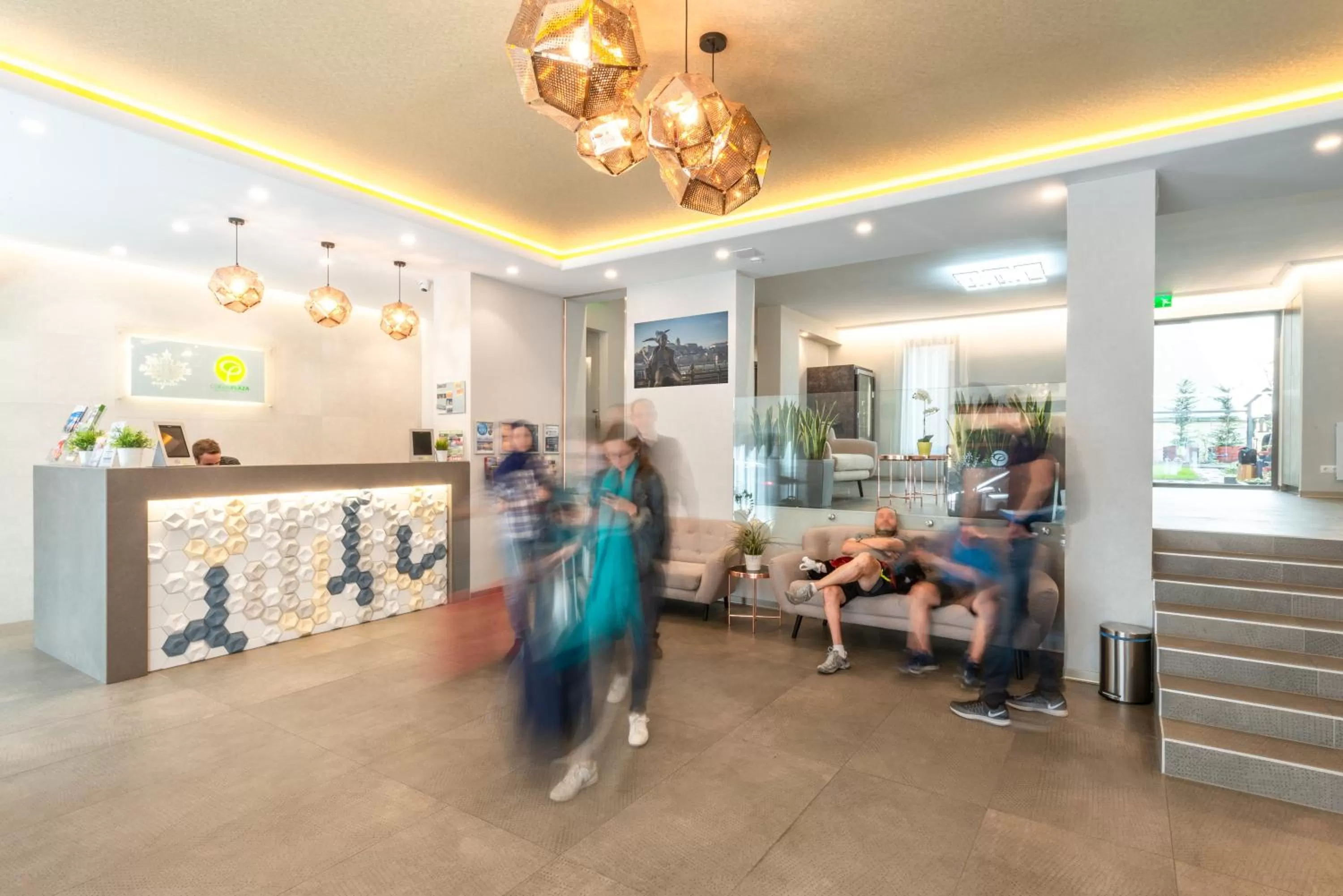 Lobby or reception in Corvin Plaza Apartments & Suites